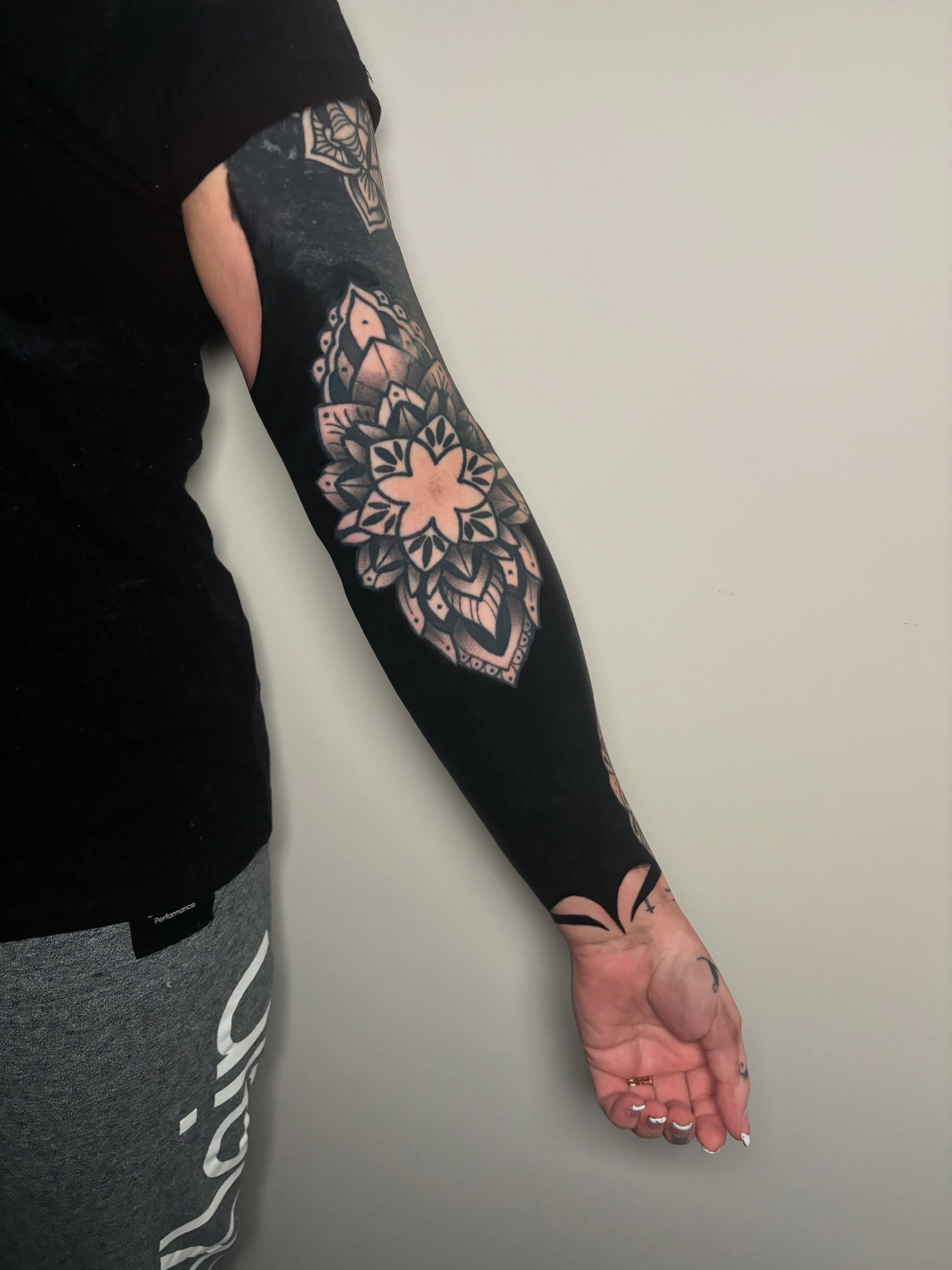 Mandala geometric tattoo on the forearm by Aubri Aunna