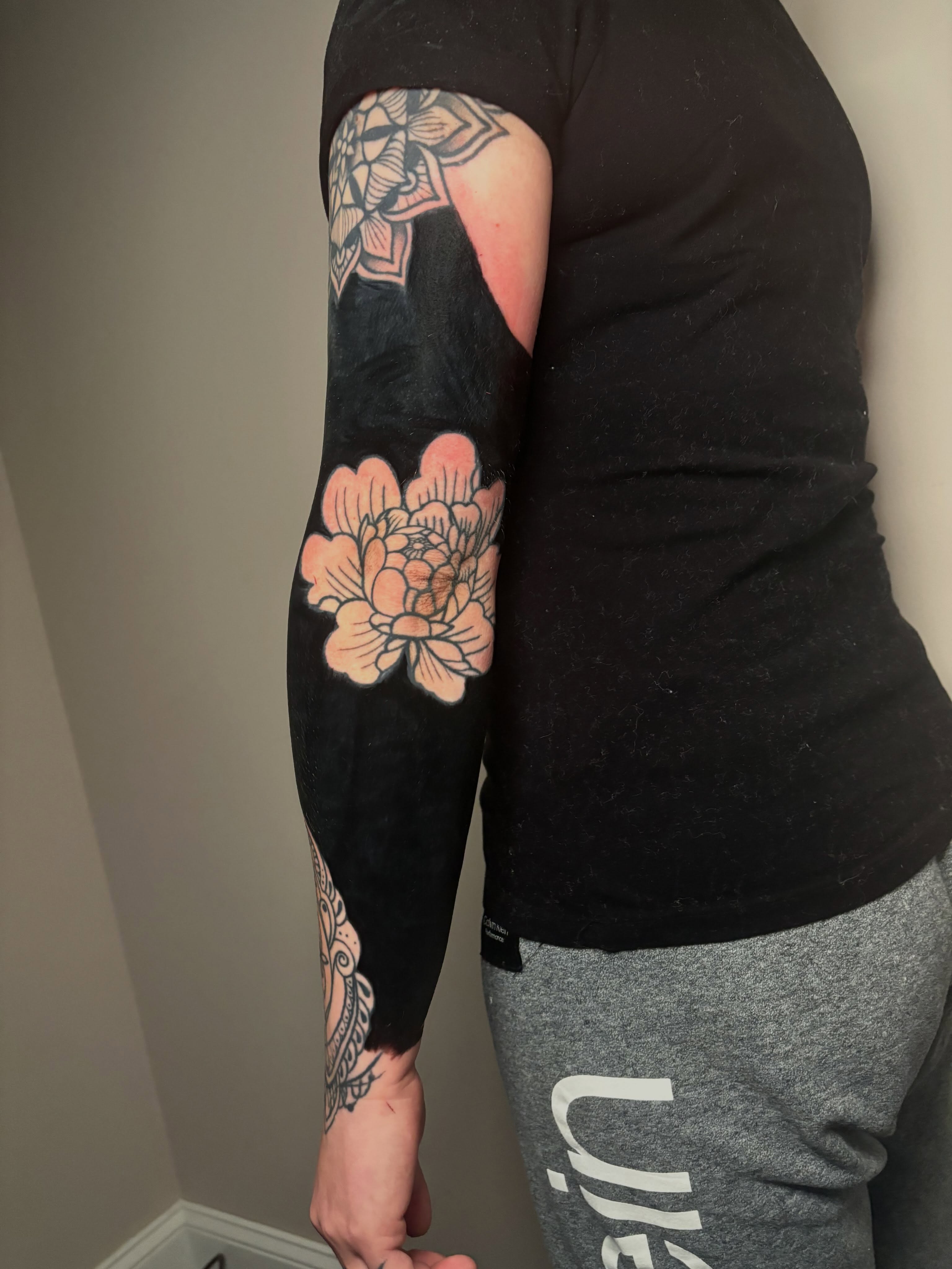 Floral design American traditional tattoo on the forearm by Aubri Aunna