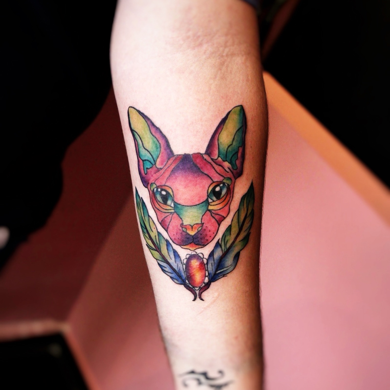 Cat geometric tattoo on the forearm by Yana Aizen