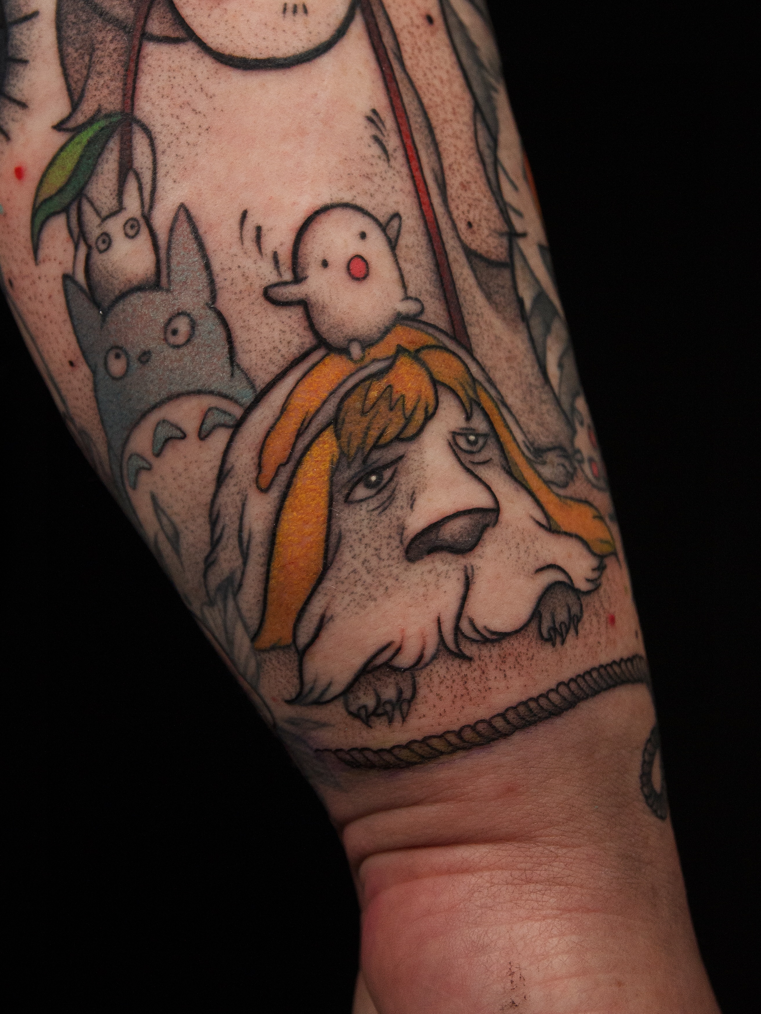 Totoro and dog dotwork tattoo on the forearm by caliope yiannos
