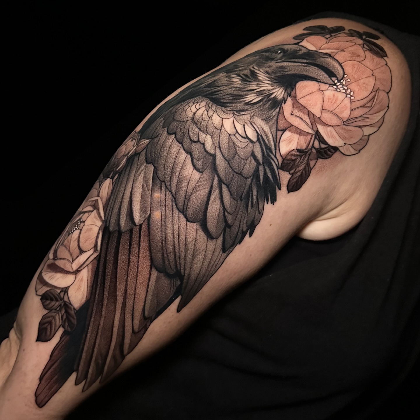 Raven and roses realism tattoo on the shoulder by Breah Beshore Kirk