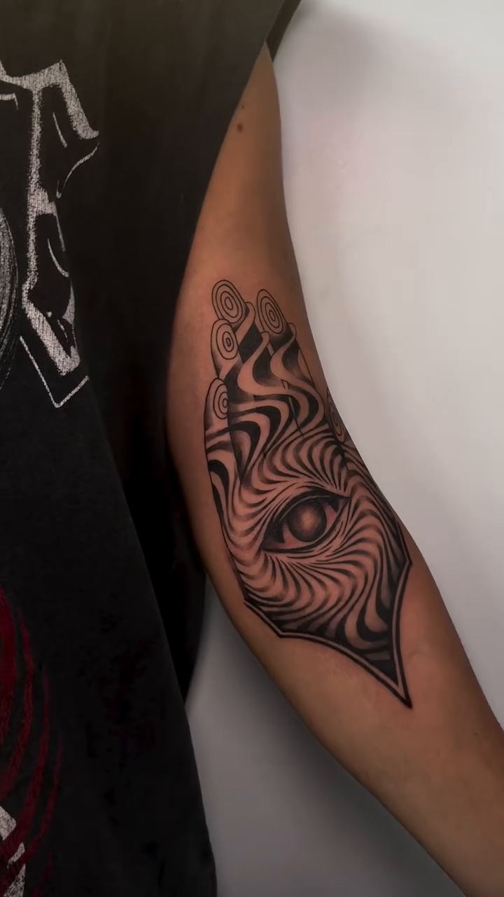 Abstract eye design surrealism tattoo on the forearm by Tattoos by Tessa