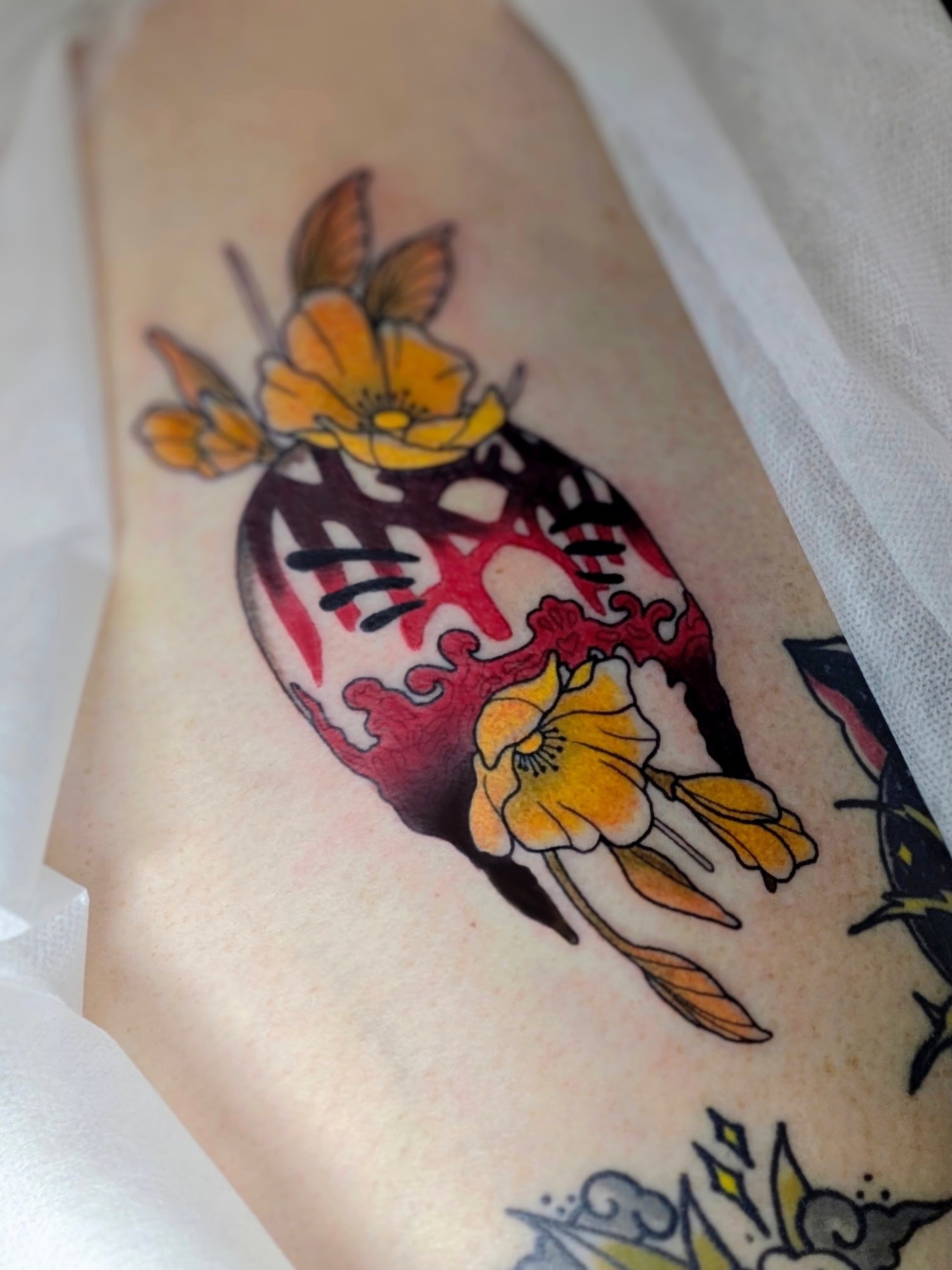 Flower skull American traditional tattoo on the forearm by Kyndall Lynn, Waxahachie, Texas