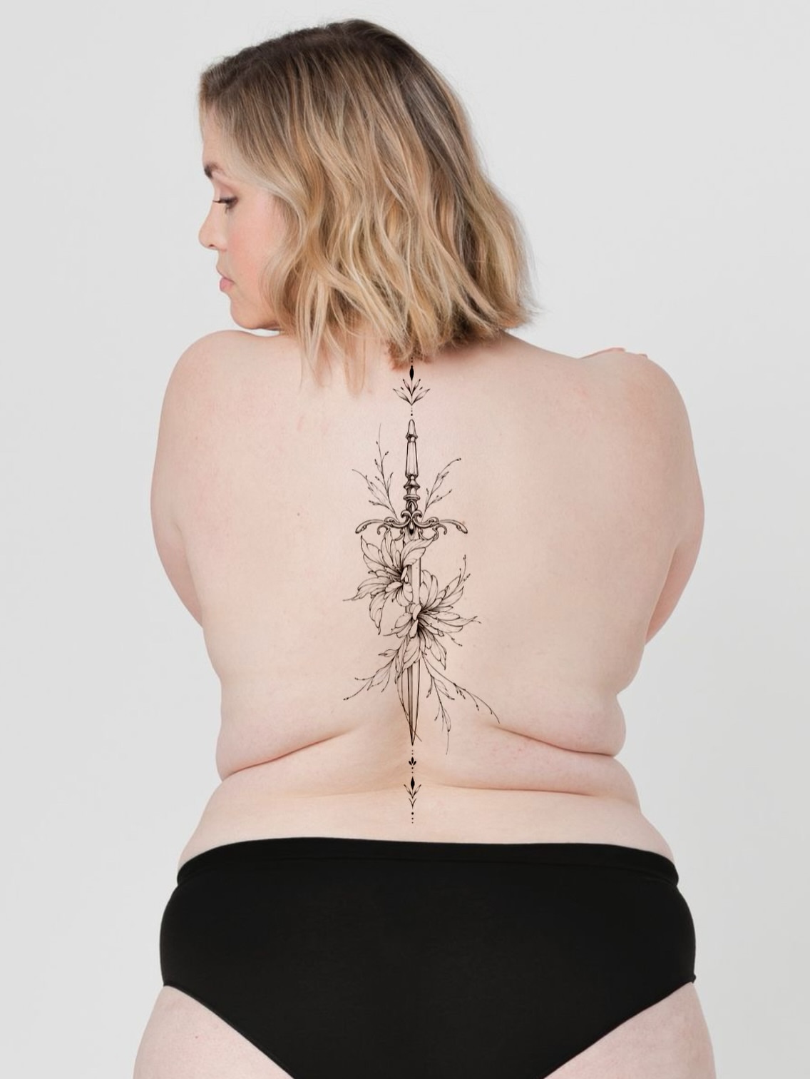 Sword and leaves black and grey tattoo on the back by Fineline Tattoos DFW
