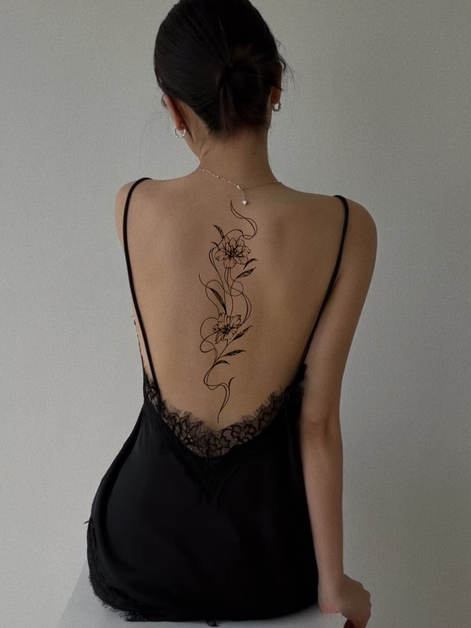 Floral design fine line tattoo on the back by Fineline Tattoos DFW