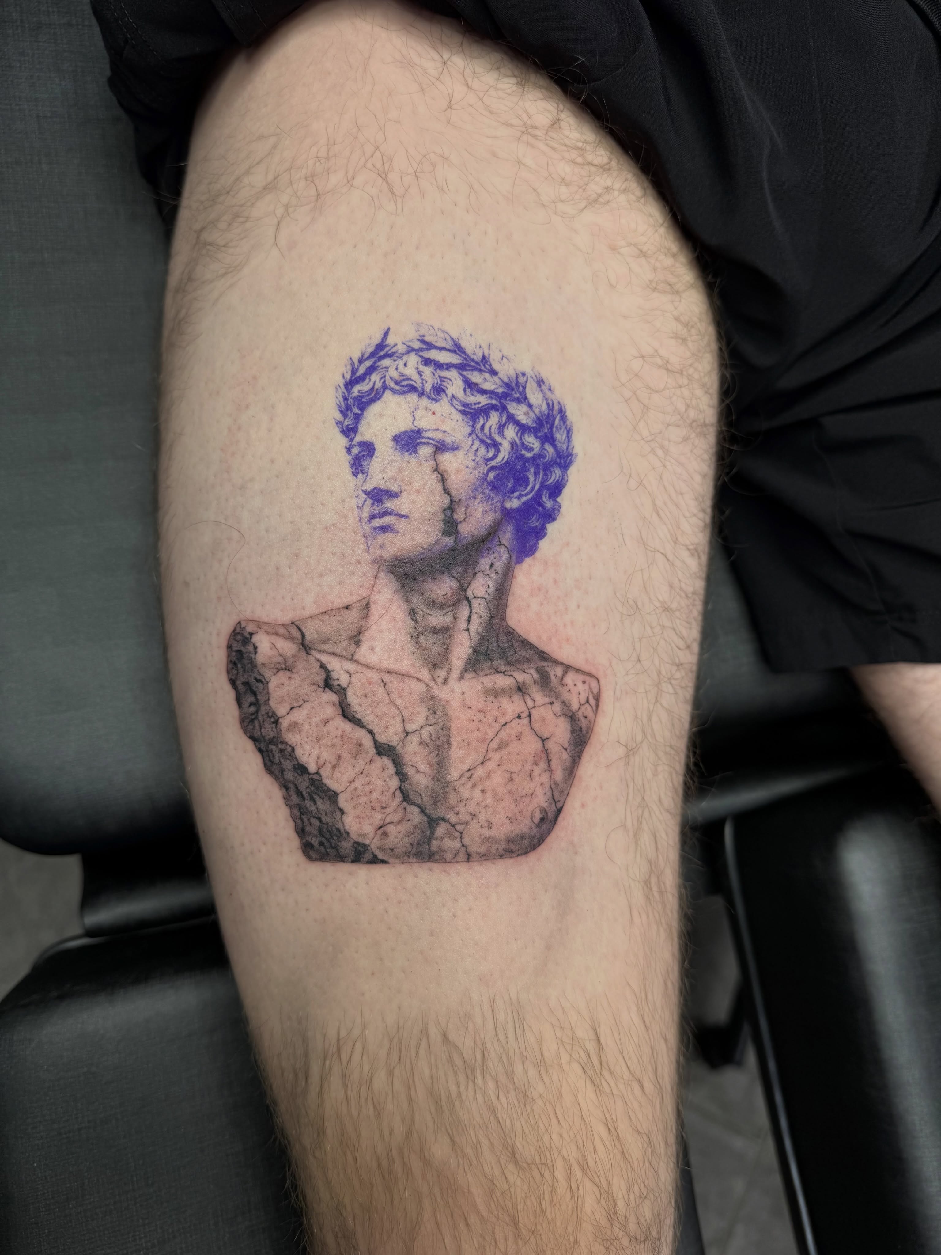 Statue bust realism tattoo on the thigh by Juan Guzman