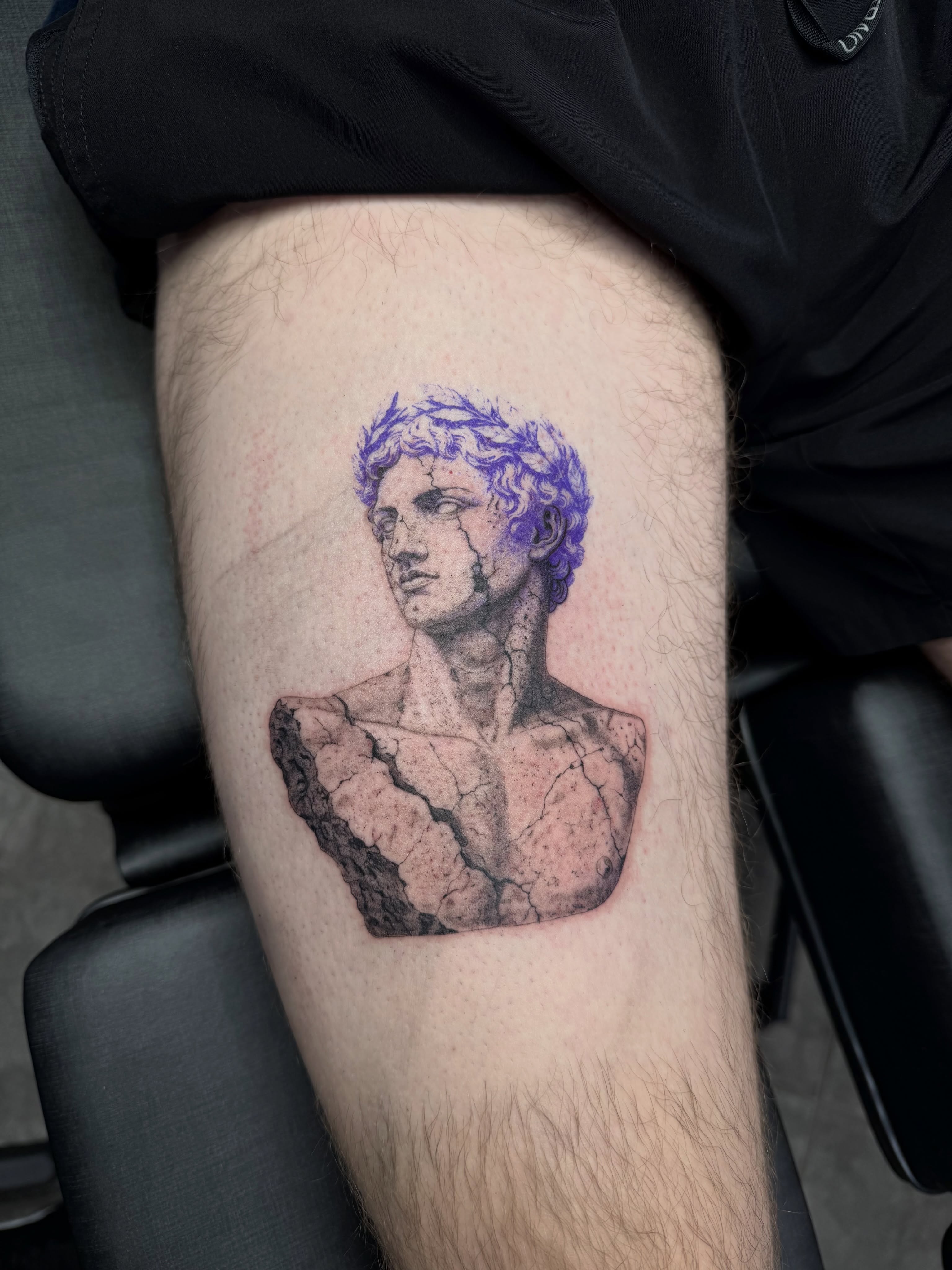 Statue bust realism tattoo on the thigh by Juan Guzman