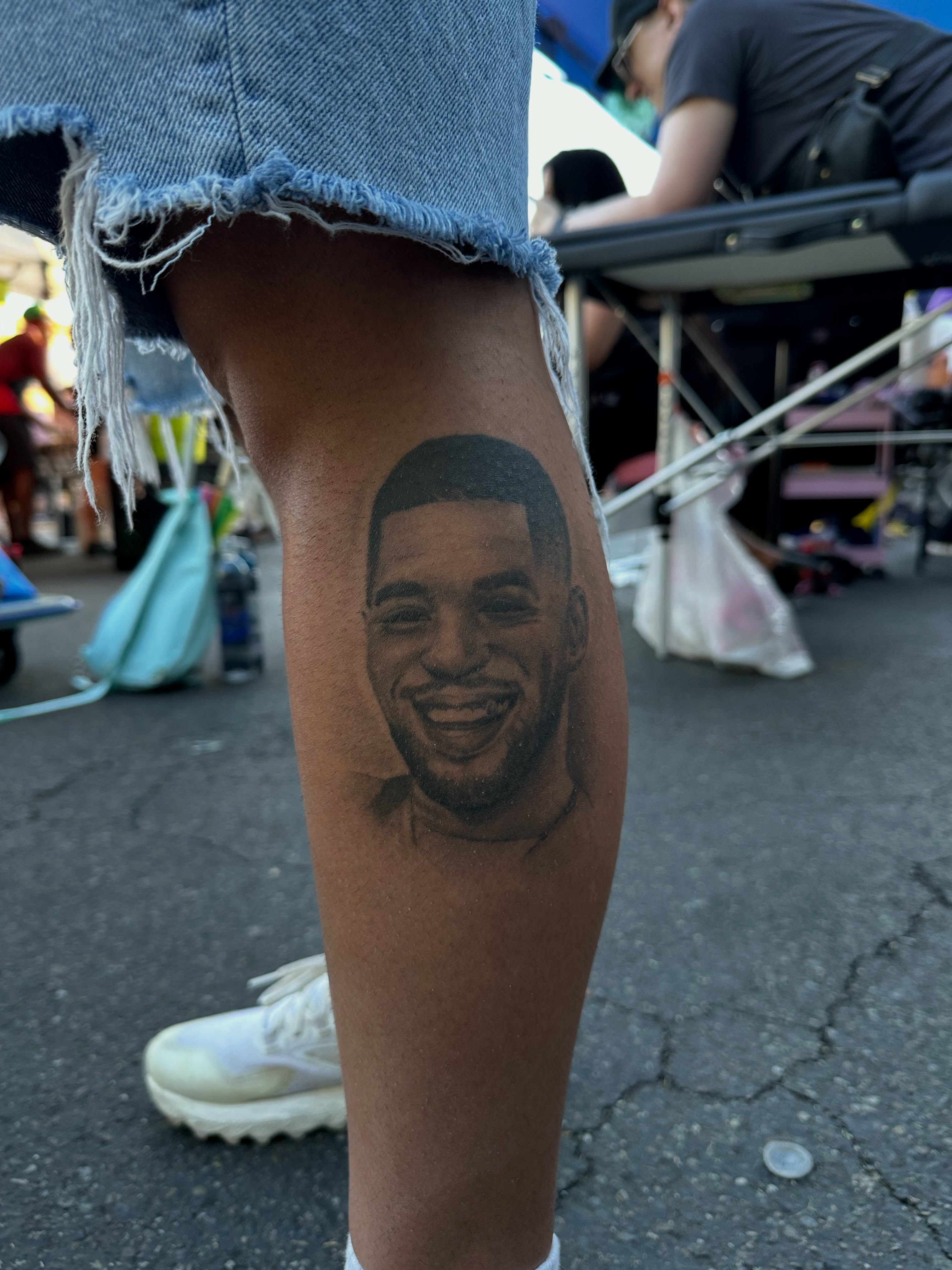Portrait realism tattoo on the leg by Nate Webb