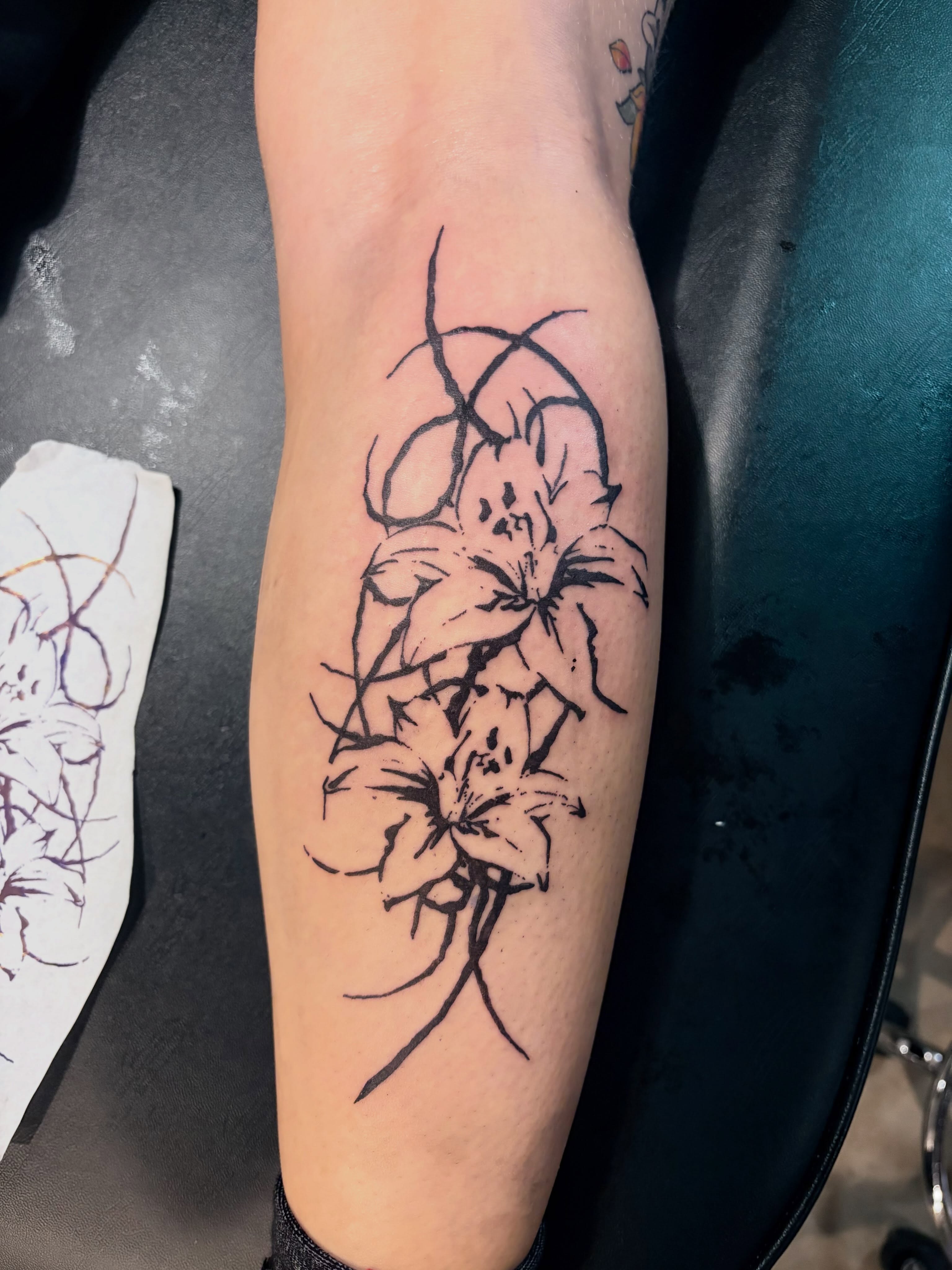 Lilies black and grey tattoo on the forearm by blastedbybk
