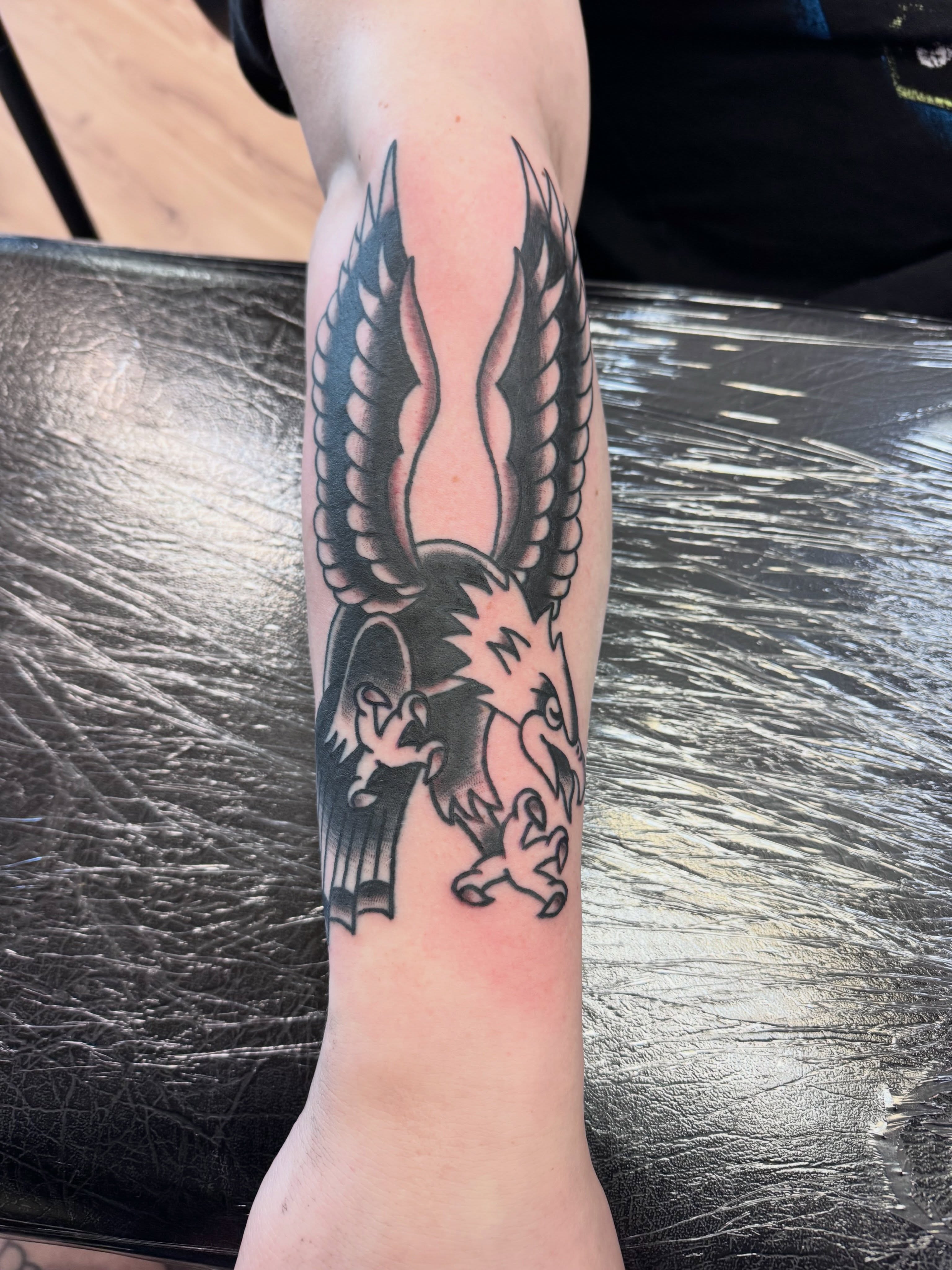 Eagle black and grey tattoo on the forearm by Justin Chapman, Des Moines, Iowa