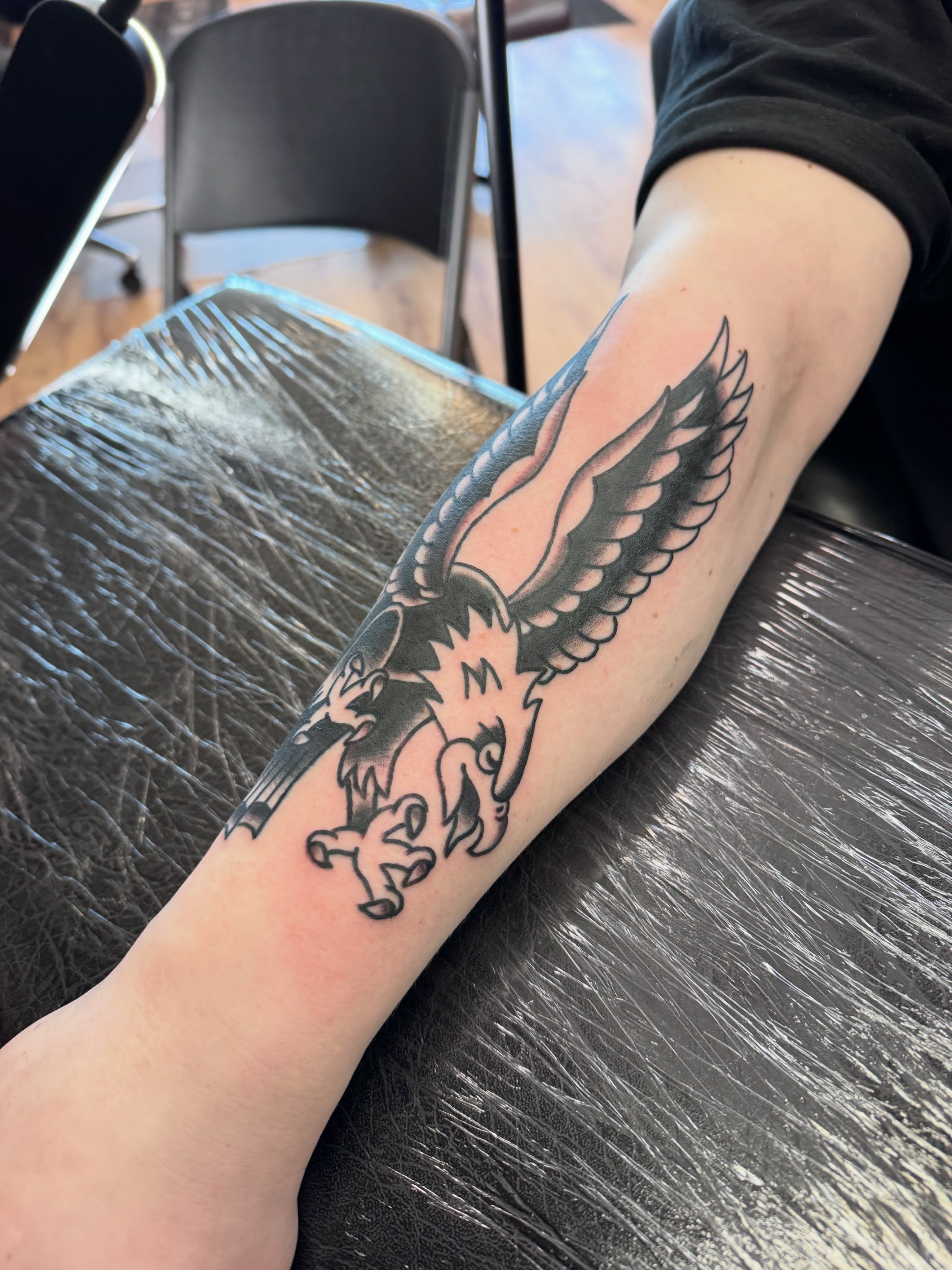 Eagle black and grey tattoo on the forearm by Justin Chapman, Des Moines, Iowa