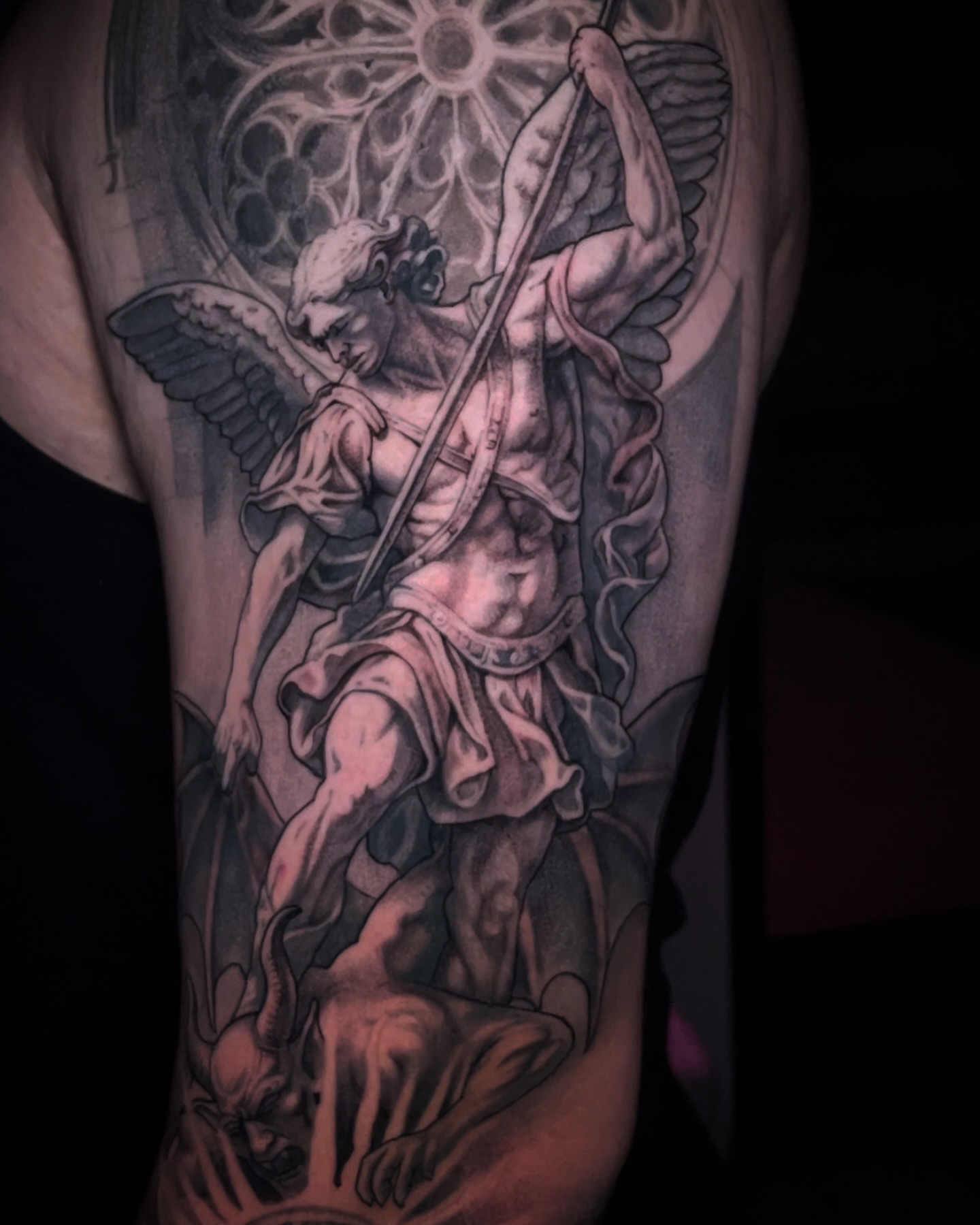 St. michael slaying dragon realism tattoo on the ribs by Chato