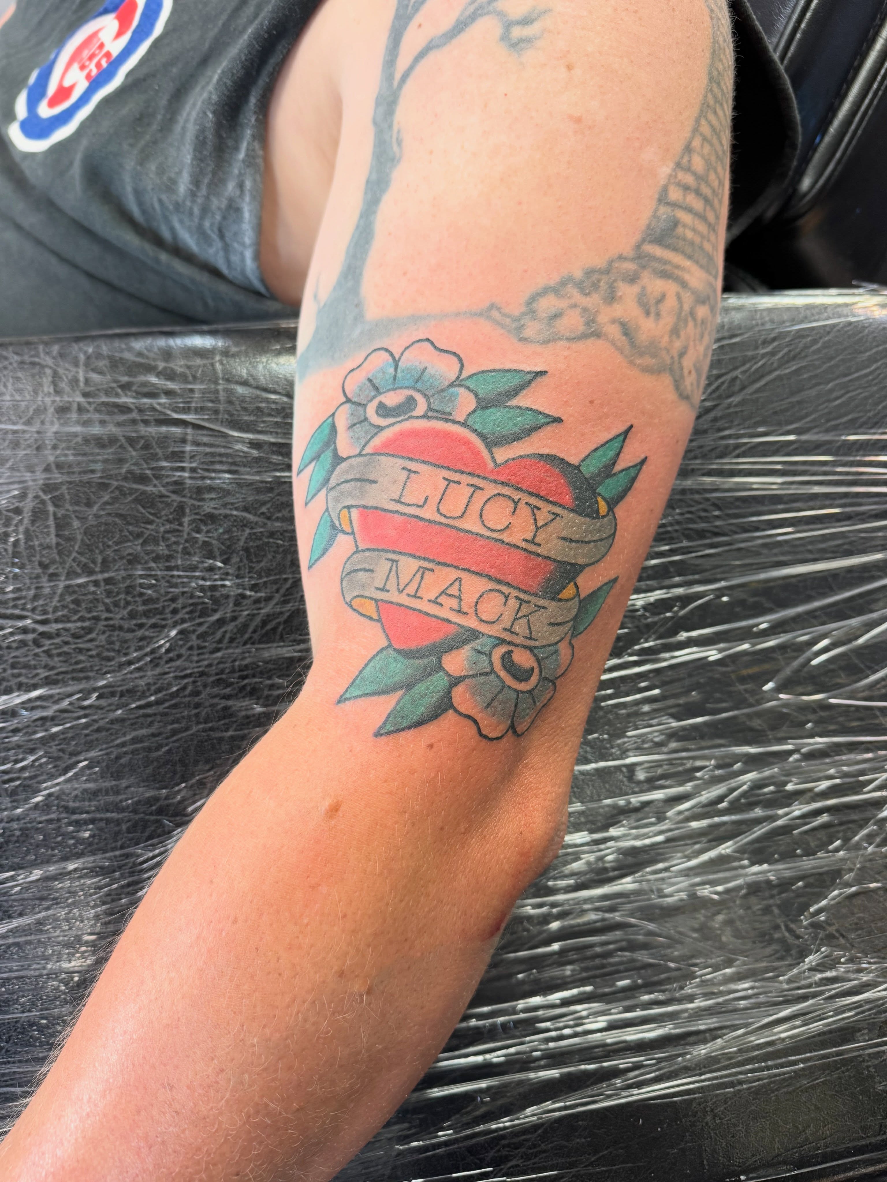 Heart with name American traditional tattoo on the forearm by Justin Chapman, Des Moines, Iowa