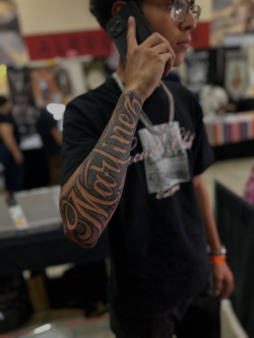 Script lettering lettering tattoo on the forearm by Ruben