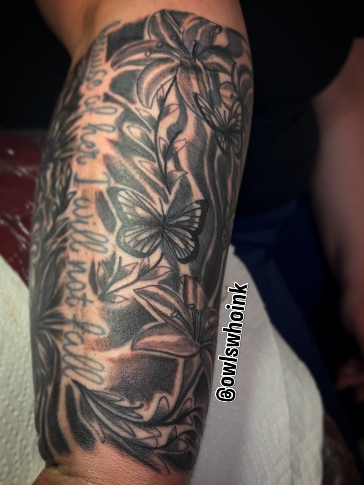 Lilies and butterflies black and grey tattoo on the forearm by OwlWhoINKs