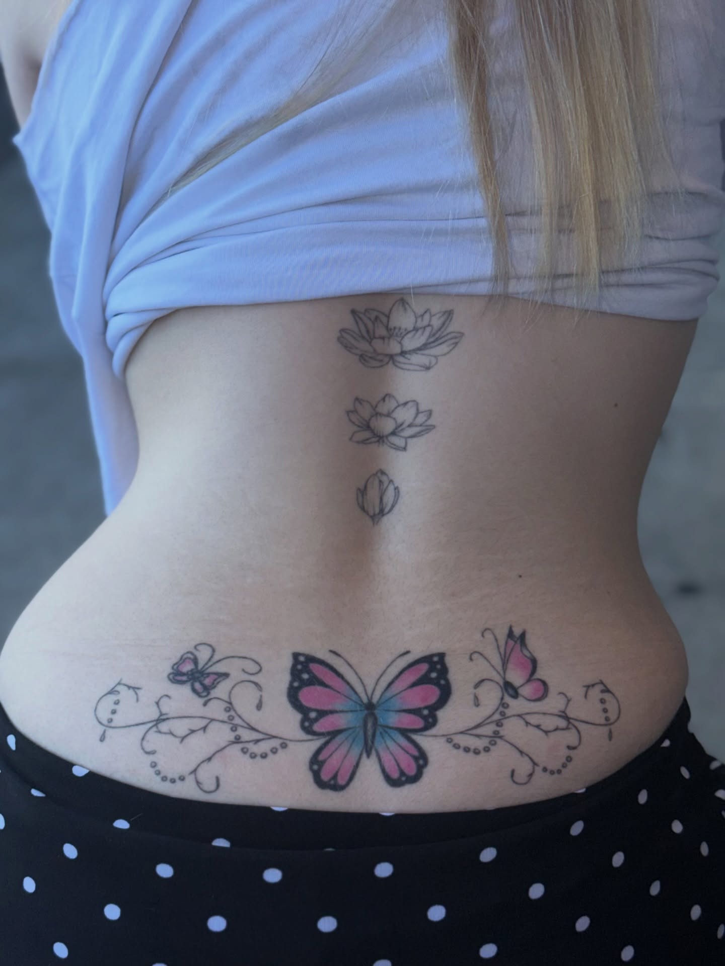 Butterfly and lotus new school tattoo on the torso by Maddie Blosser, Portland, Oregon