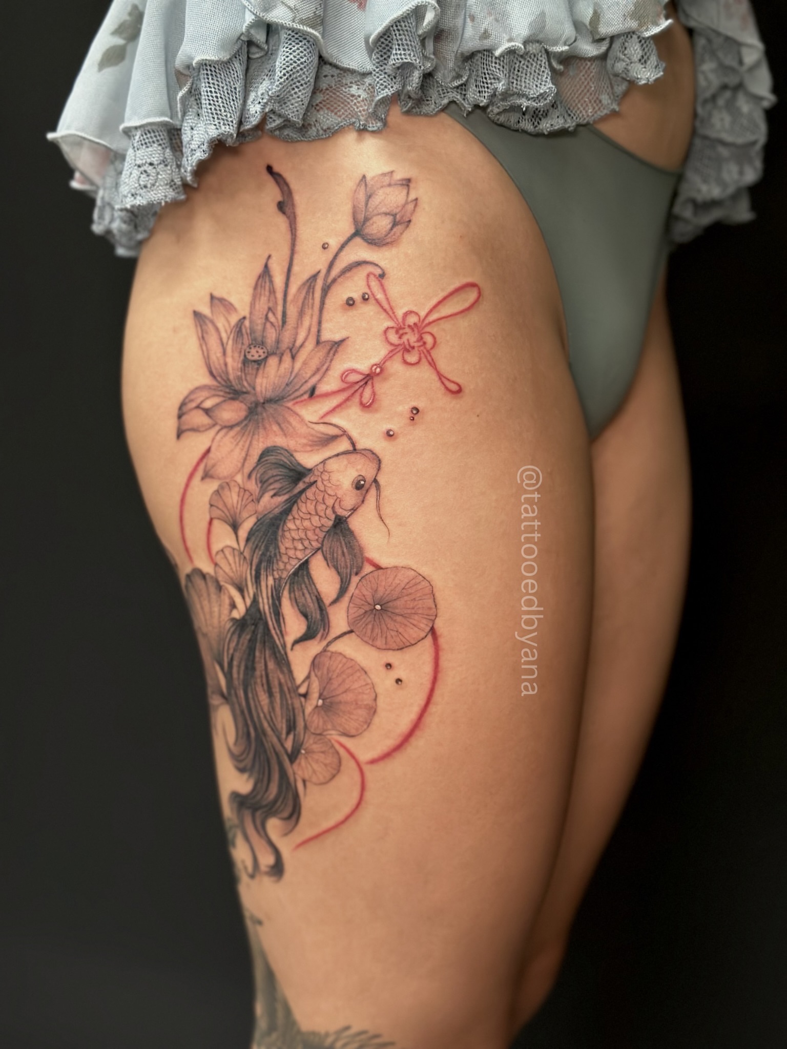 Koi fish and lotus dotwork tattoo on the thigh by Tattoo artist Denver