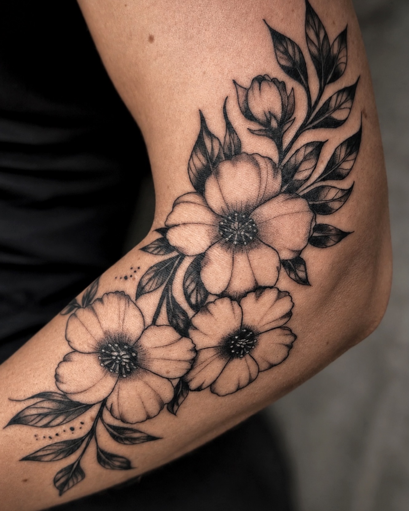 Flowers black and grey tattoo on the forearm by Kate
