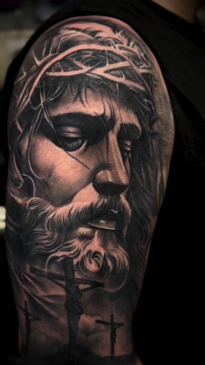 Realism tattoo on the upper arm by Raul Rodriguez