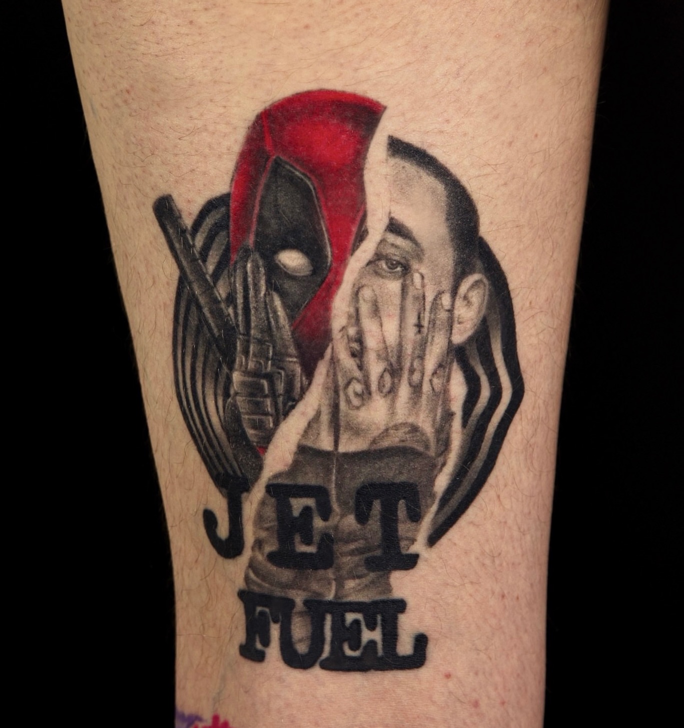 Deadpool and jet fuel black and grey tattoo on the forearm by Milk Tattoos 🇸🇻🇪🇸