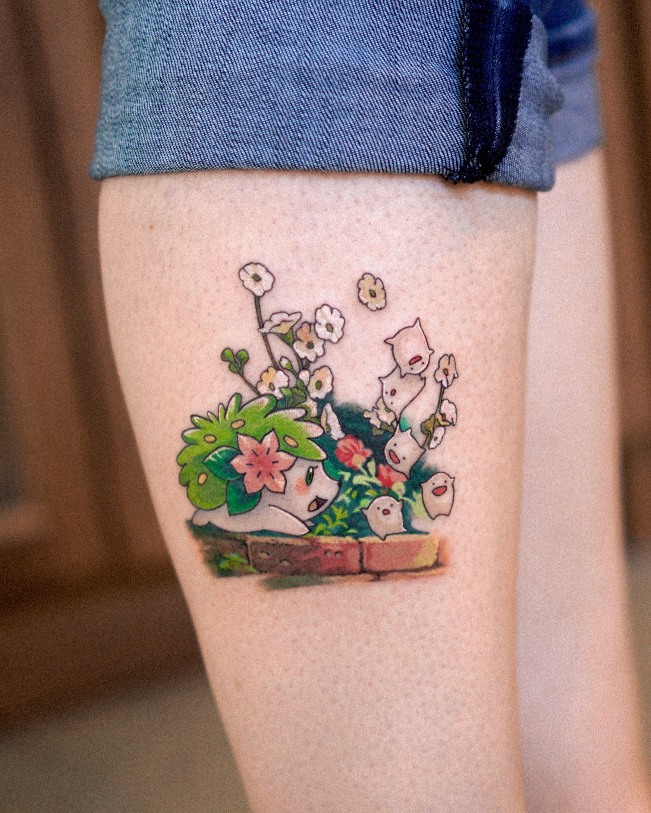 Ghosts and flowers dotwork tattoo on the thigh by Eden