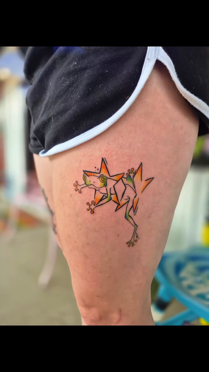 Geometric frog with starburst American traditional tattoo on the thigh by π΅ππππ§π»ββοΈβΛκ©ο½‘β