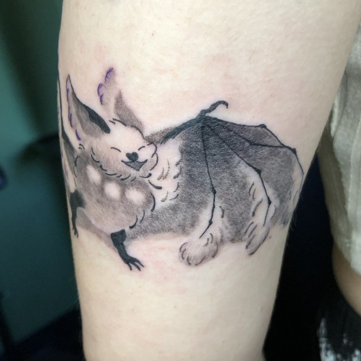 Bat black and grey tattoo on the forearm by Rowan Lee