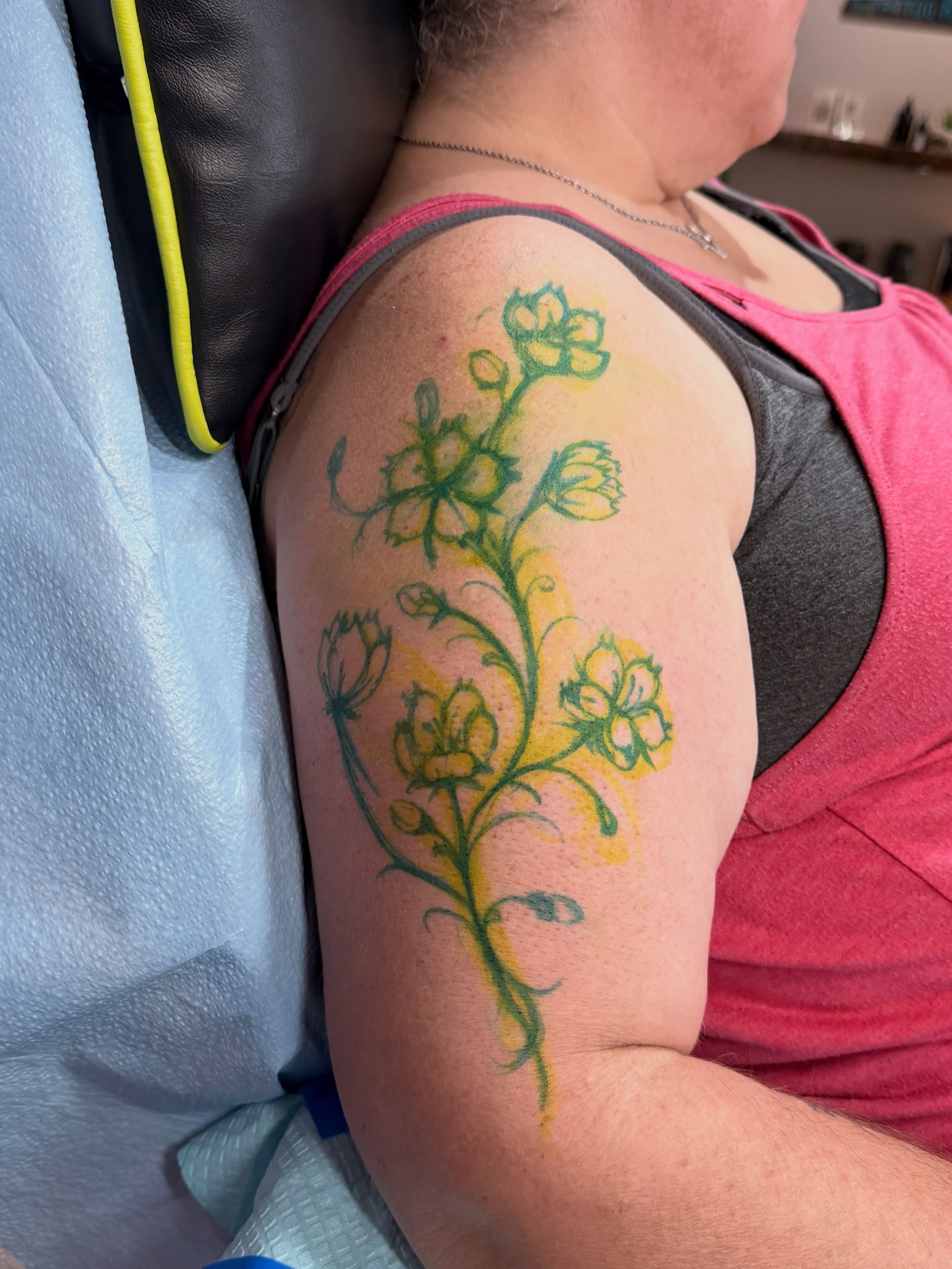 Flower watercolor tattoo on the upper arm by Ty Pallotta, Austin, Texas