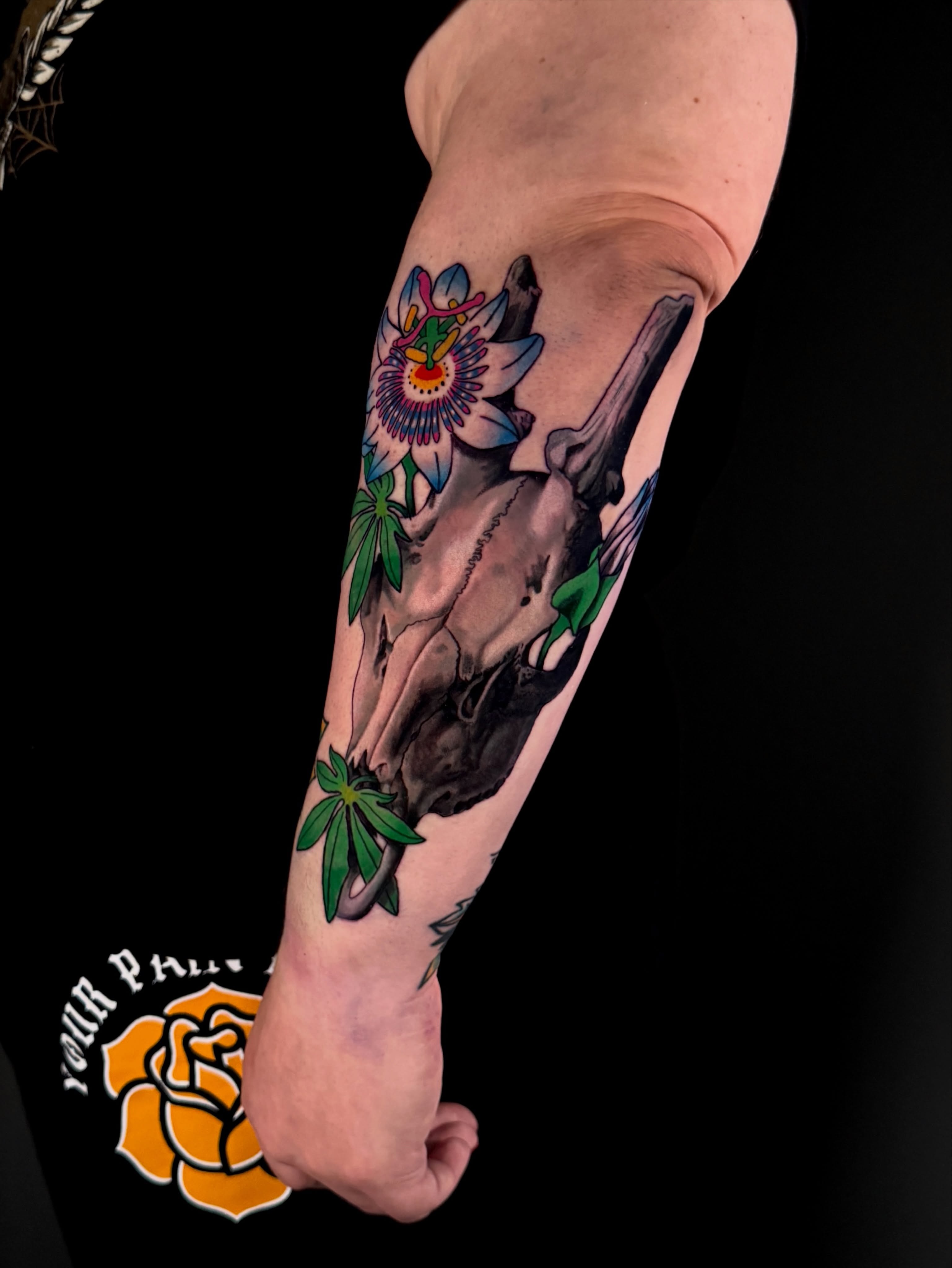 Passion flower and skull new school tattoo on the forearm by Dallas Tattoo Artist