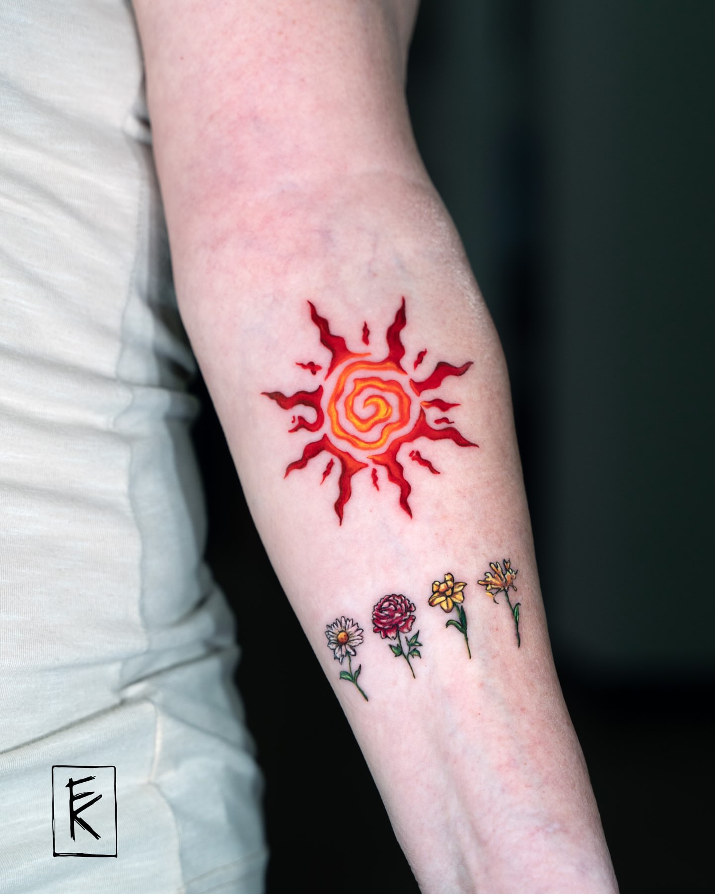 Sun and flowers new school tattoo on the forearm by elizaveta