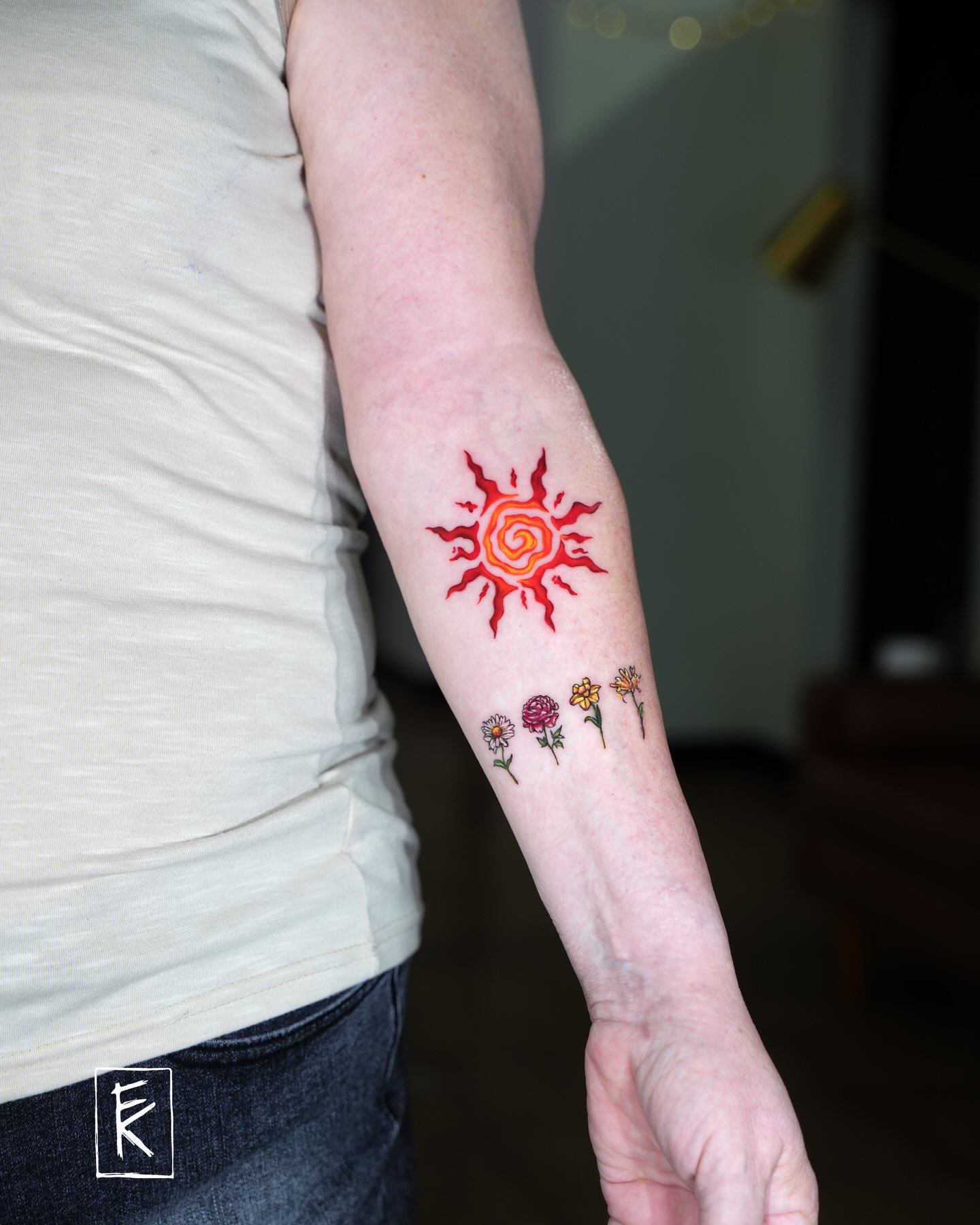 Sun and flowers new school tattoo on the forearm by elizaveta