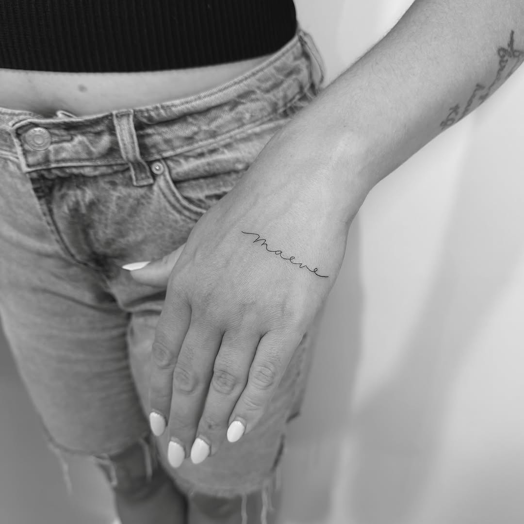 Name lettering script tattoo on the hand by Jessica, Cheektowaga, New York