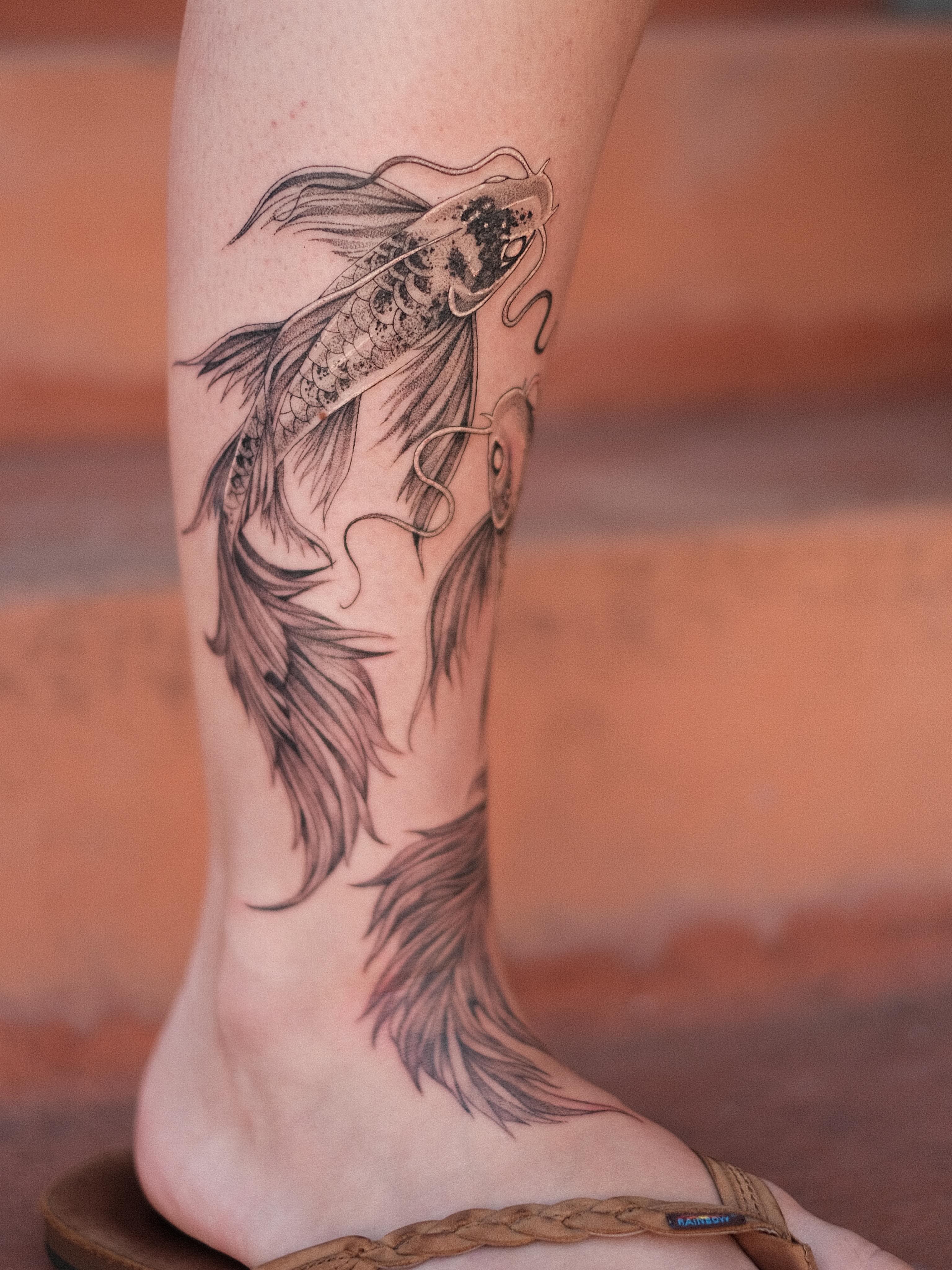 Koi fish black and grey tattoo on the calf by Isabelle Kellar, San Diego, California