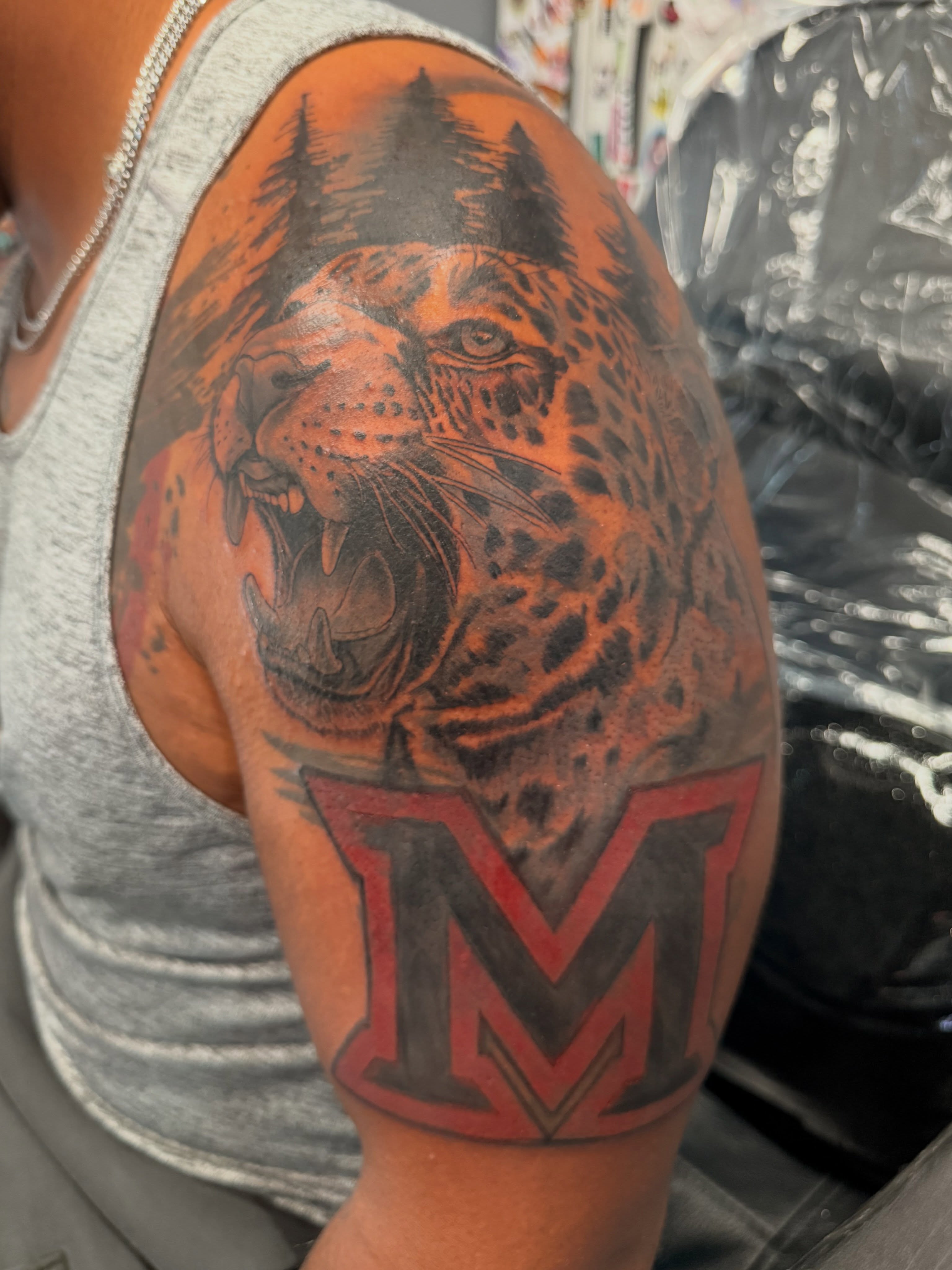 Leopard realism tattoo on the shoulder by Butta
