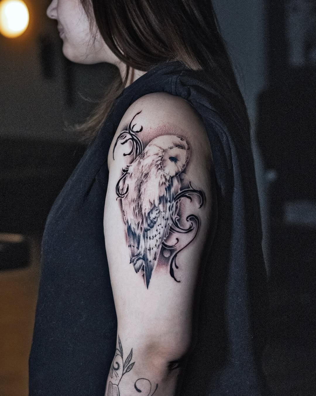 Barn owl with ornamental elements fine line tattoo on the shoulder by zanna joy