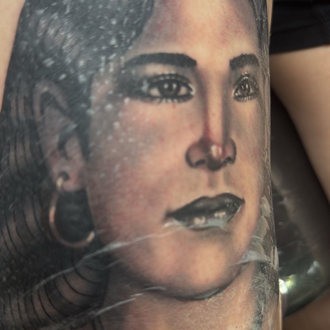 Portrait realism tattoo on the forearm by Rogelio Robles