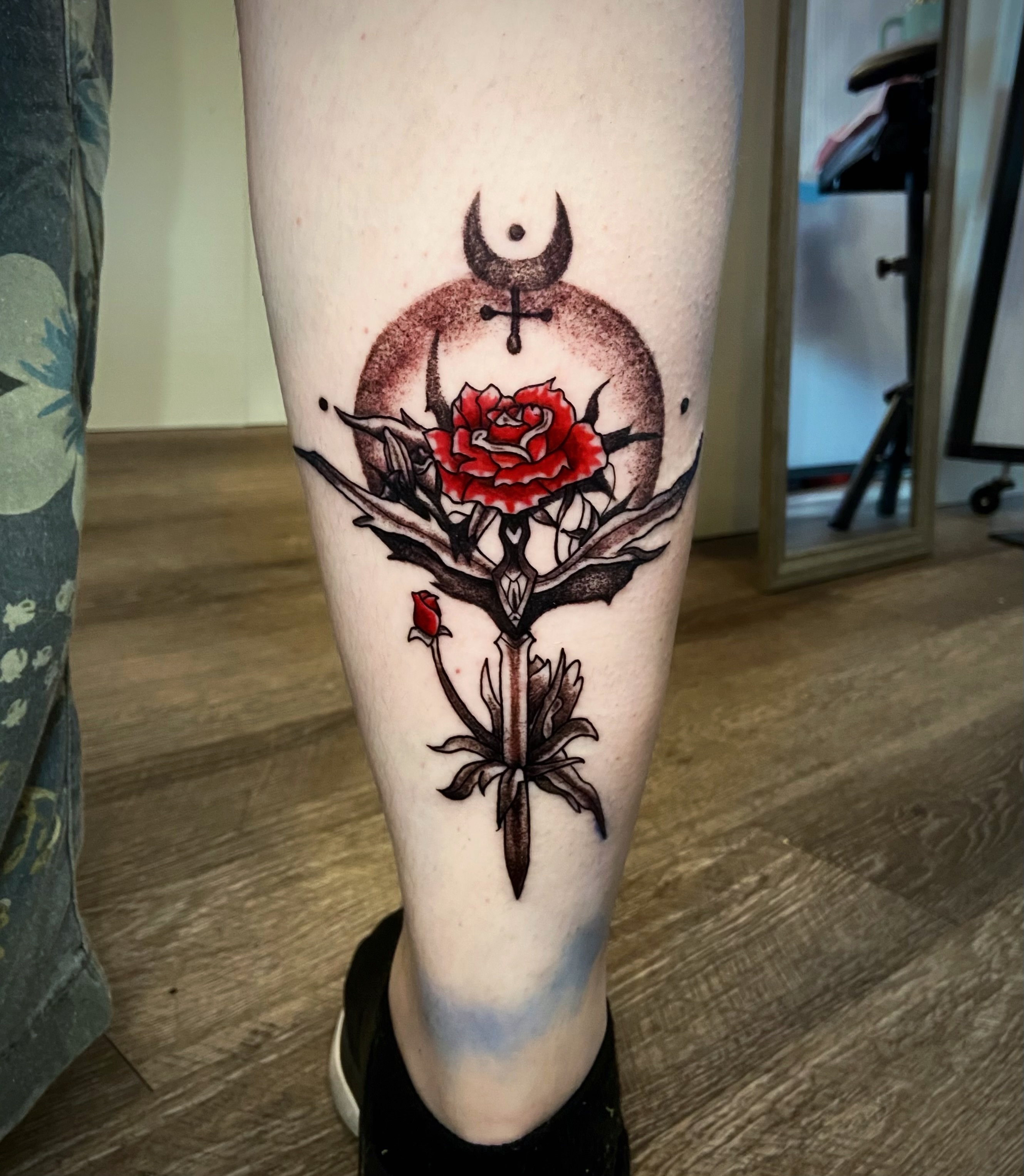 Rose and crescent moon neo-traditional tattoo on the calf by Shay Cole