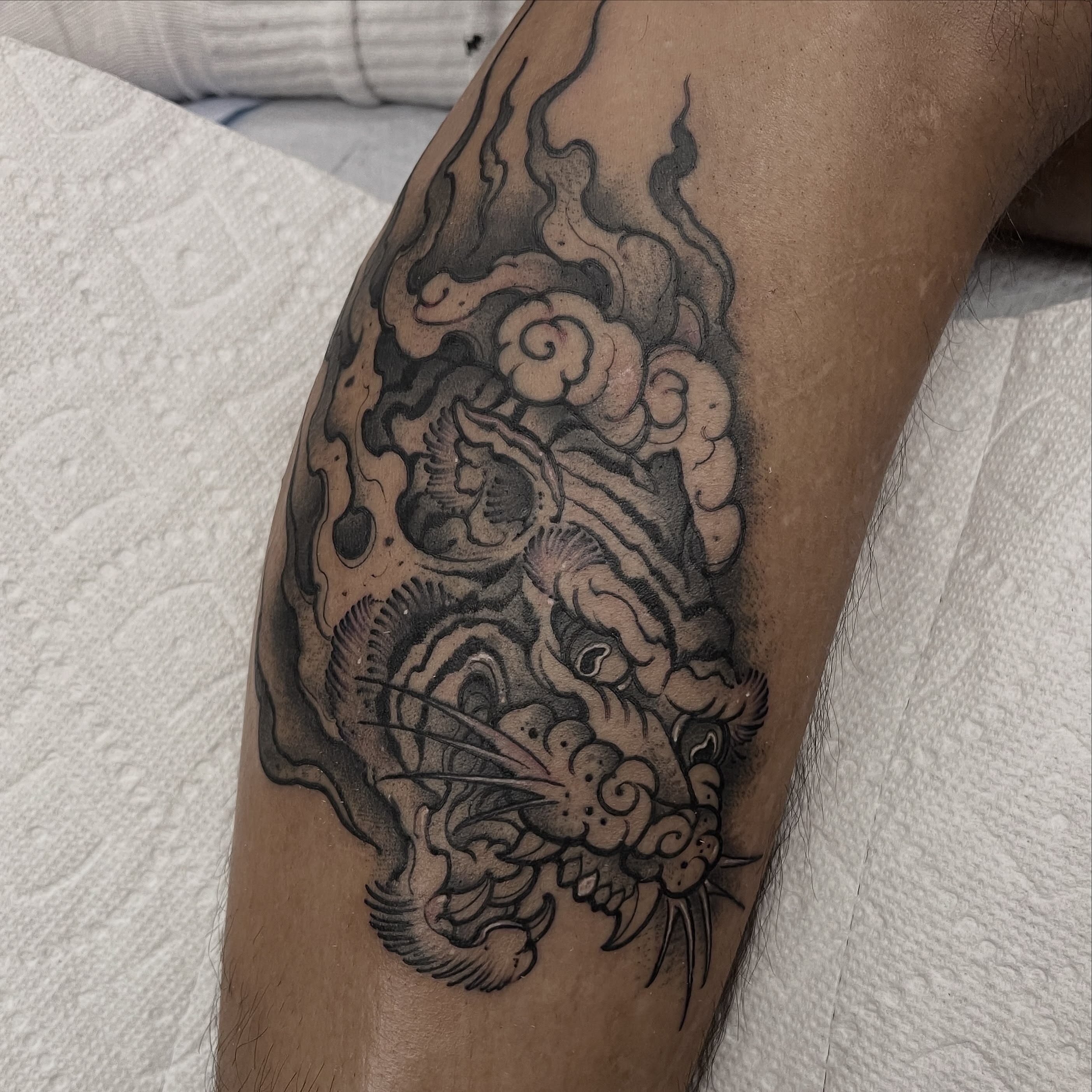 Dragon black and grey tattoo on the forearm by Brandon Mola, Chicago, Illinois