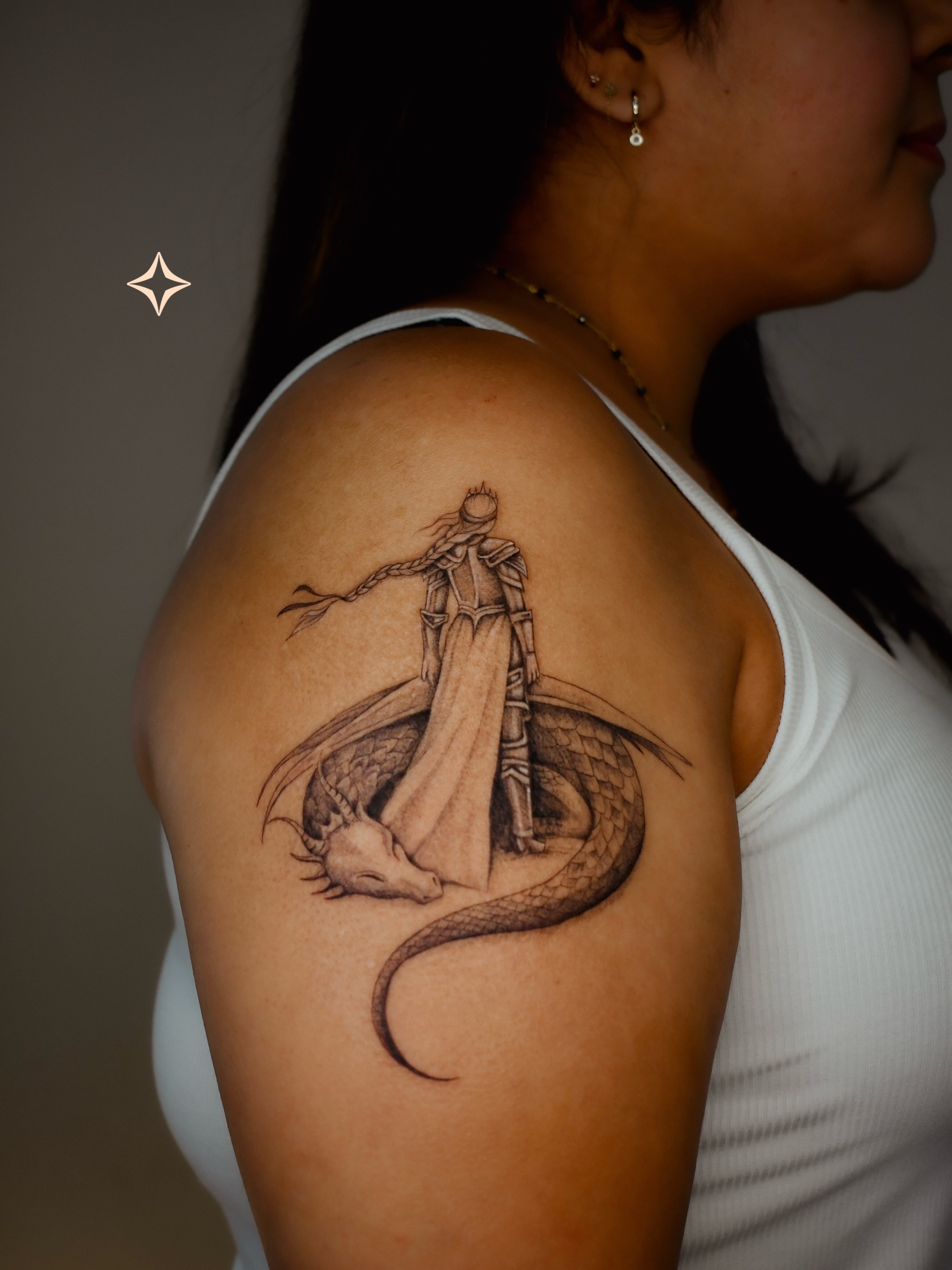 Dragon slayer realism tattoo on the shoulder by 𝐇𝐚𝐫𝐩𝐞𝐫