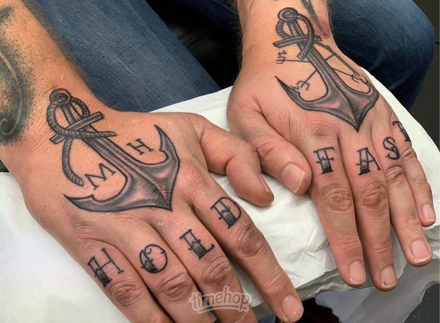 Anchor and lettering black and grey tattoo on the hand by Ruth Ormsby-Ashworth