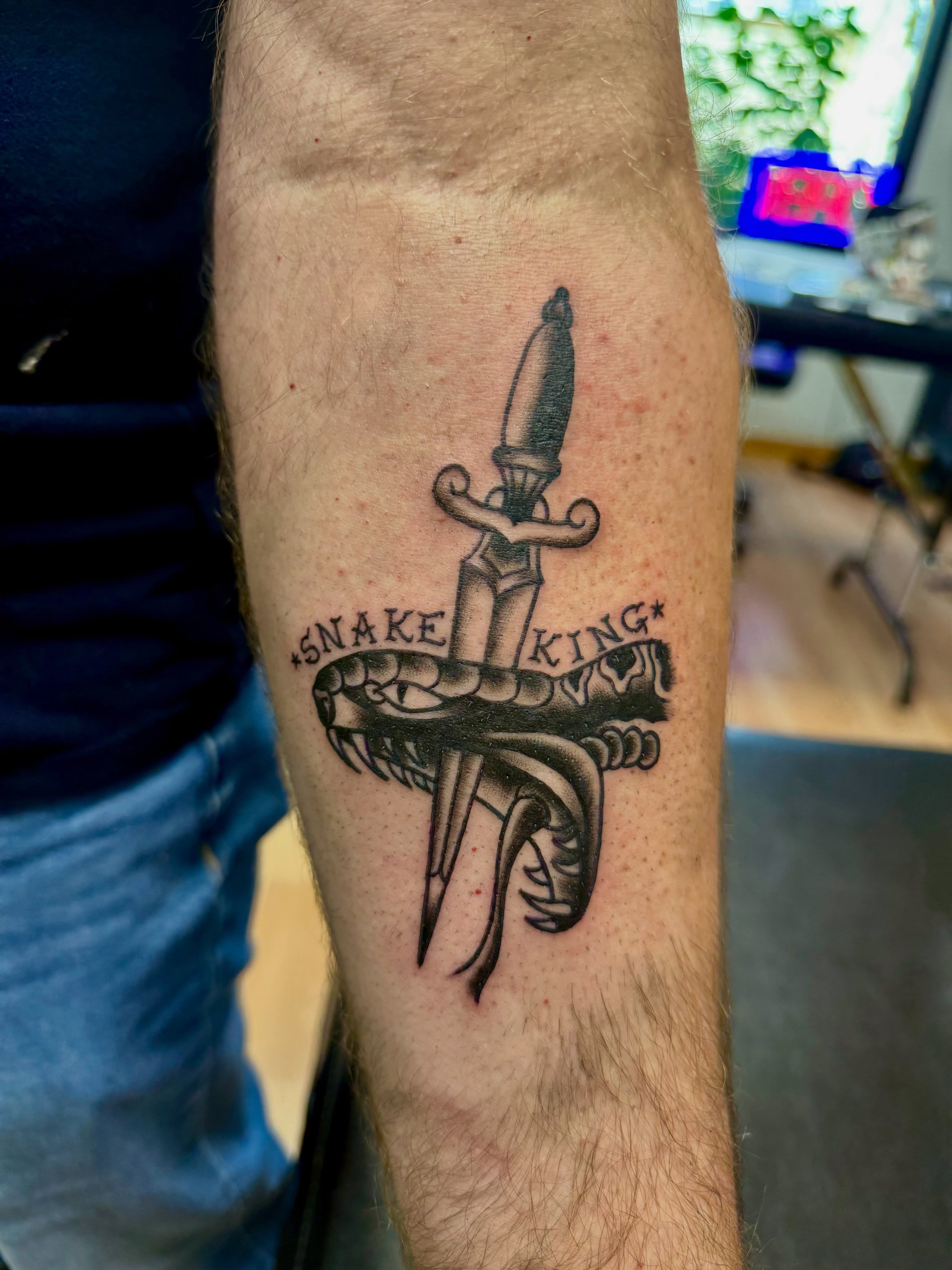 Snake and dagger black and grey tattoo on the forearm by Palmer Andrist🩸Fort Collins Tattoo Apprentice