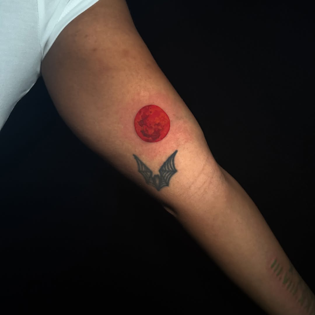 Blood moon dotwork tattoo on the forearm by Lauren B