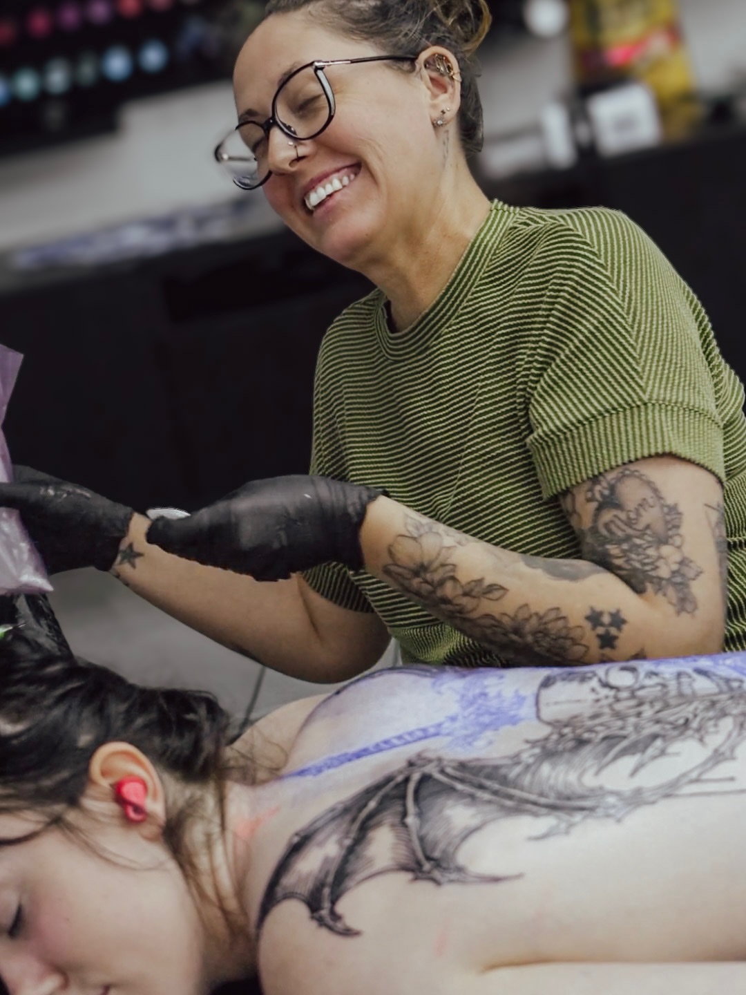 Dragon black and grey tattoo on the back by Brandiane Wells