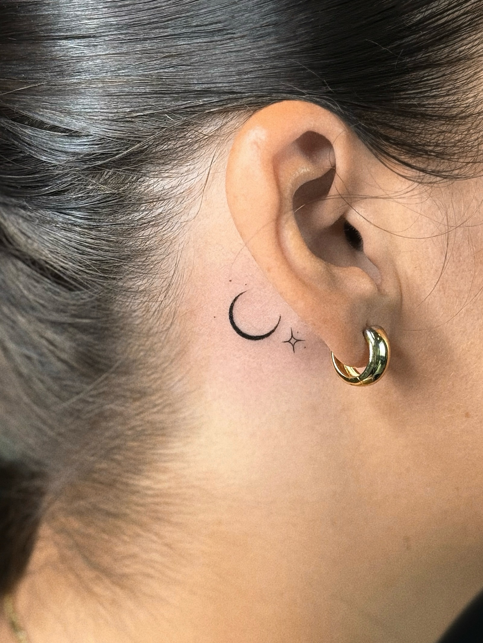 Moon and star minimalist tattoo on the neck by Victoria