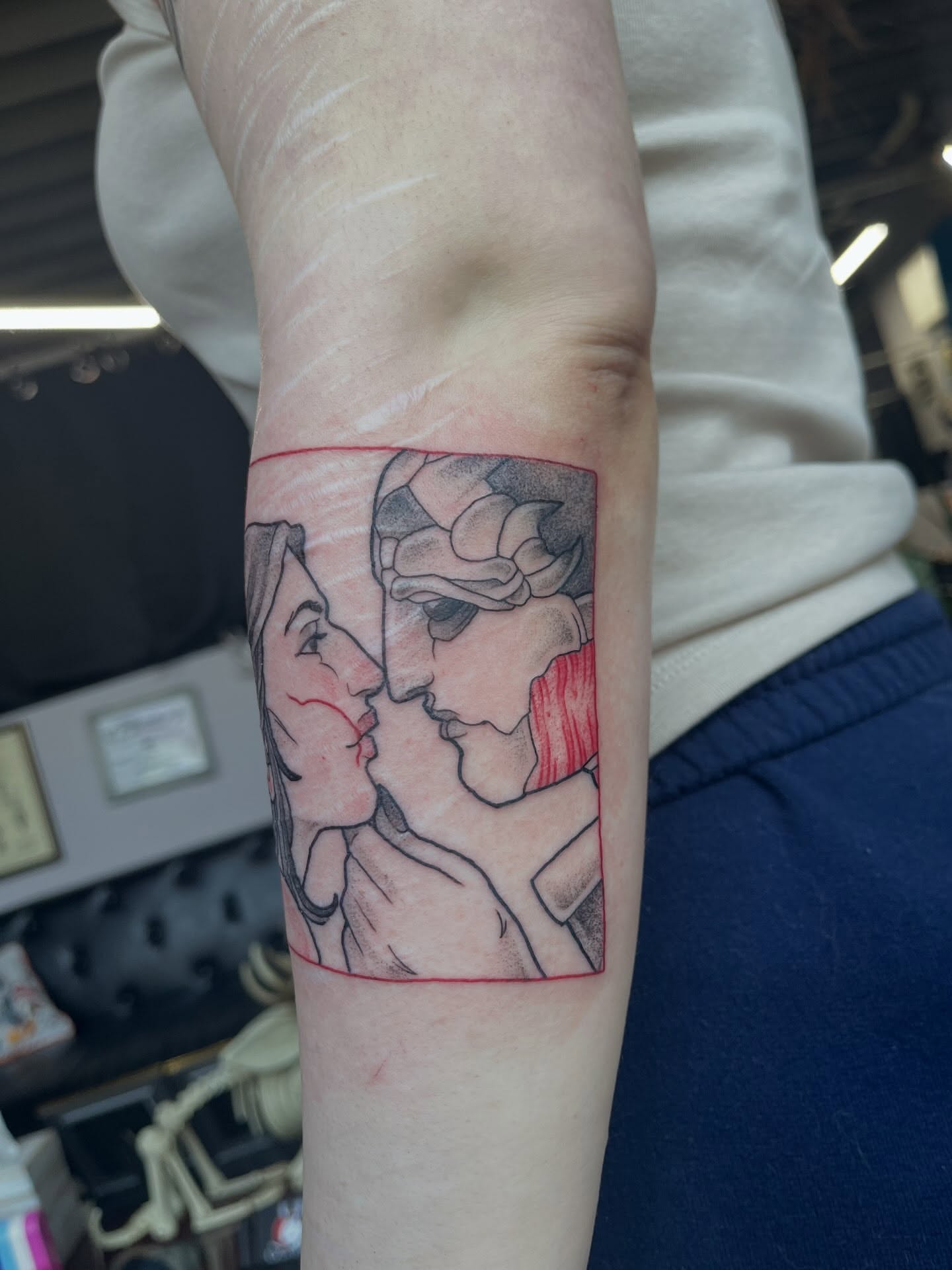 Two faces black and grey tattoo on the forearm by bunny, Minneapolis, Minnesota