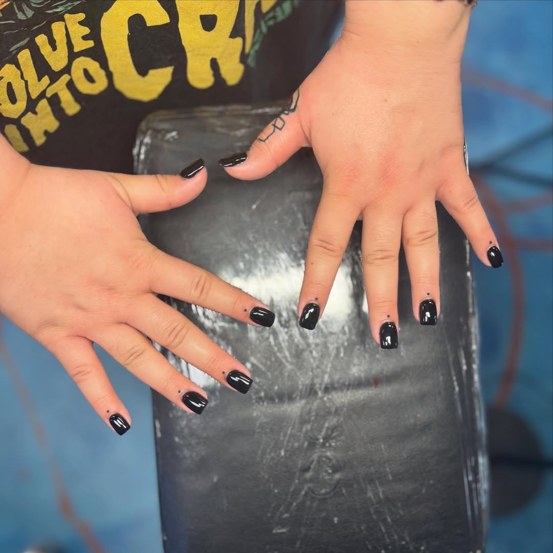 Nail art black and grey tattoo on the hand by Cam Sykes