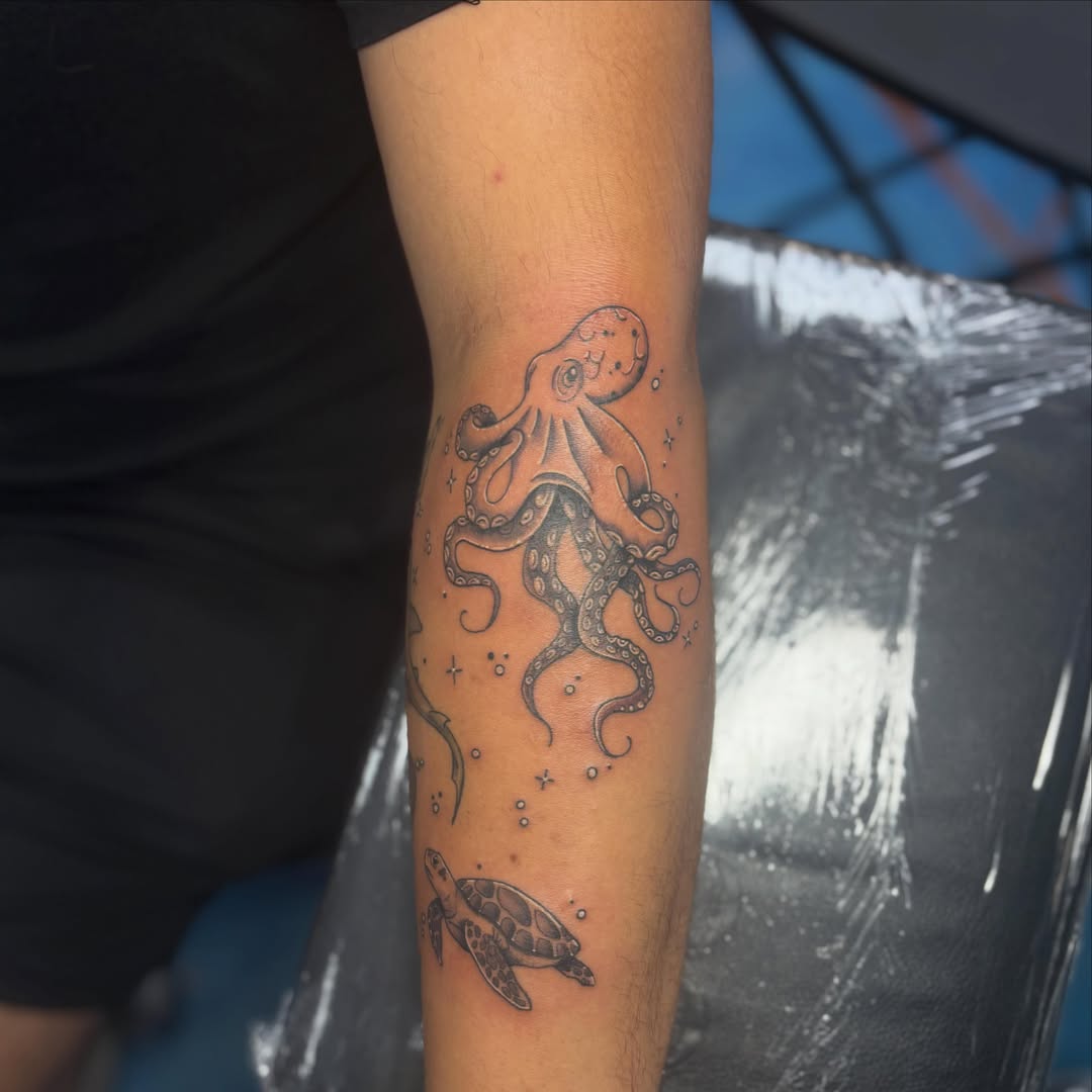 Octopus and turtle dotwork tattoo on the forearm by Cam Sykes