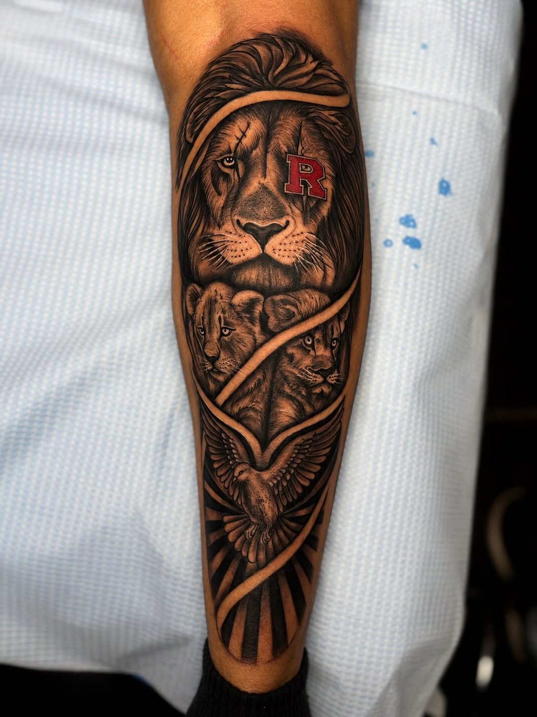 Lion family and dove Chicano tattoo on the forearm by PMU Artist