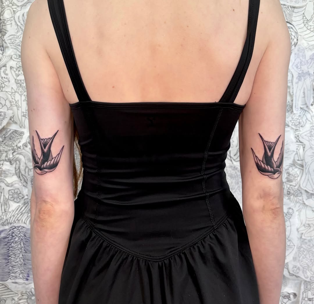 Swallow black and grey tattoo on the forearm by Danelle ✶ Nashville Tattooer