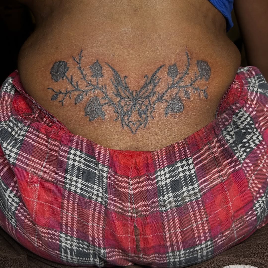 Butterfly and roses tattoo on the torso by Sarah Sharee💃🏽
